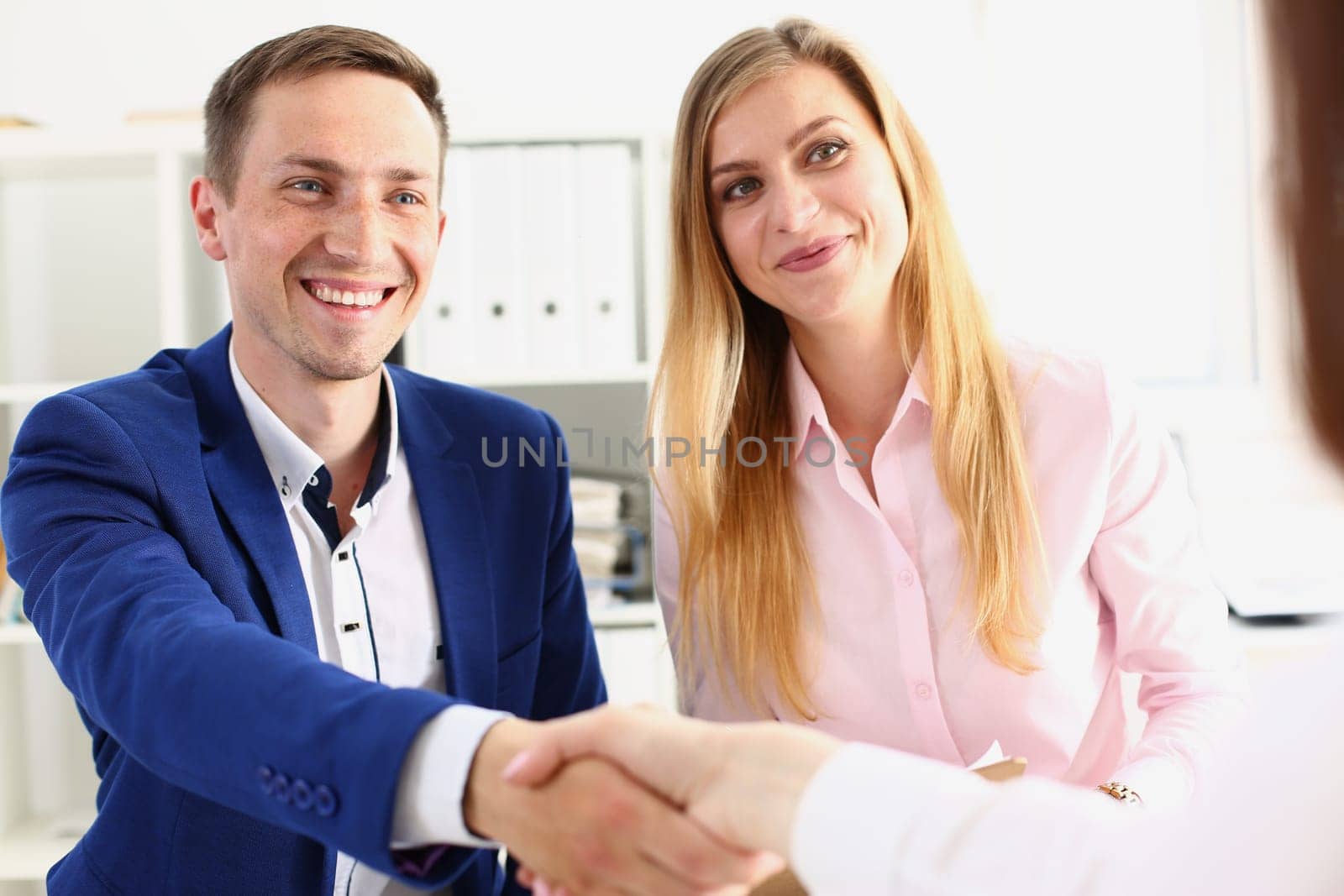 Family couple or business team shaking hands with client. Handshake of partners and conclusion of business contract