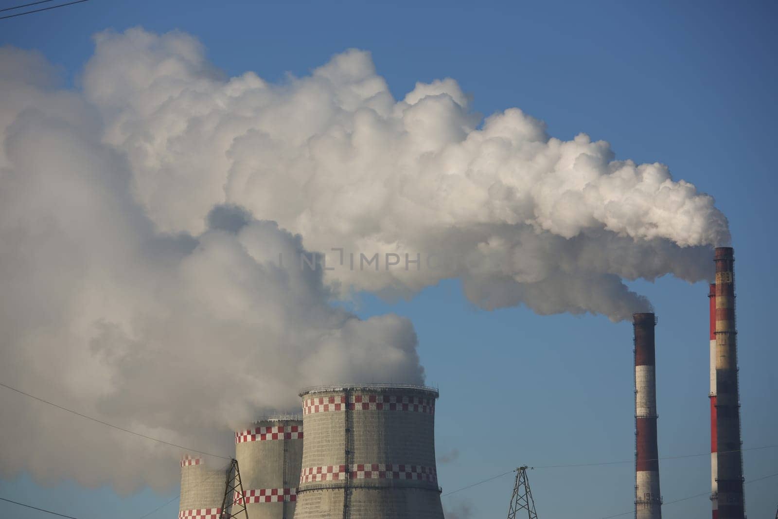 Gas thermal power plant with huge pipes smoke and steam. Combined heat and power plant concept