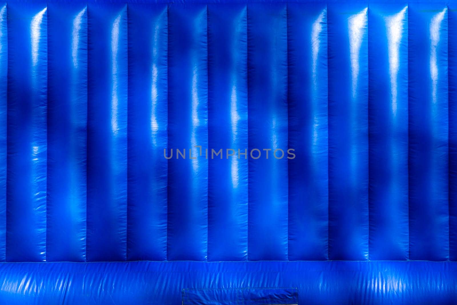 Blue inflatable trampoline texture or background.