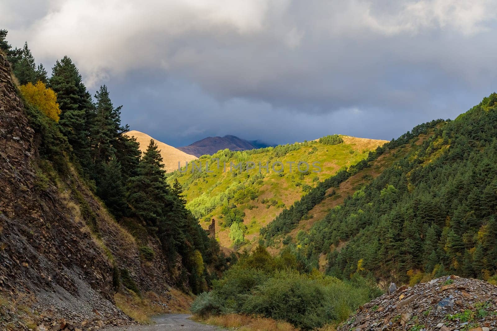 Highlands of North Ossetia. Mountains of the Caucasus. High mountains in the rays of the setting sun
