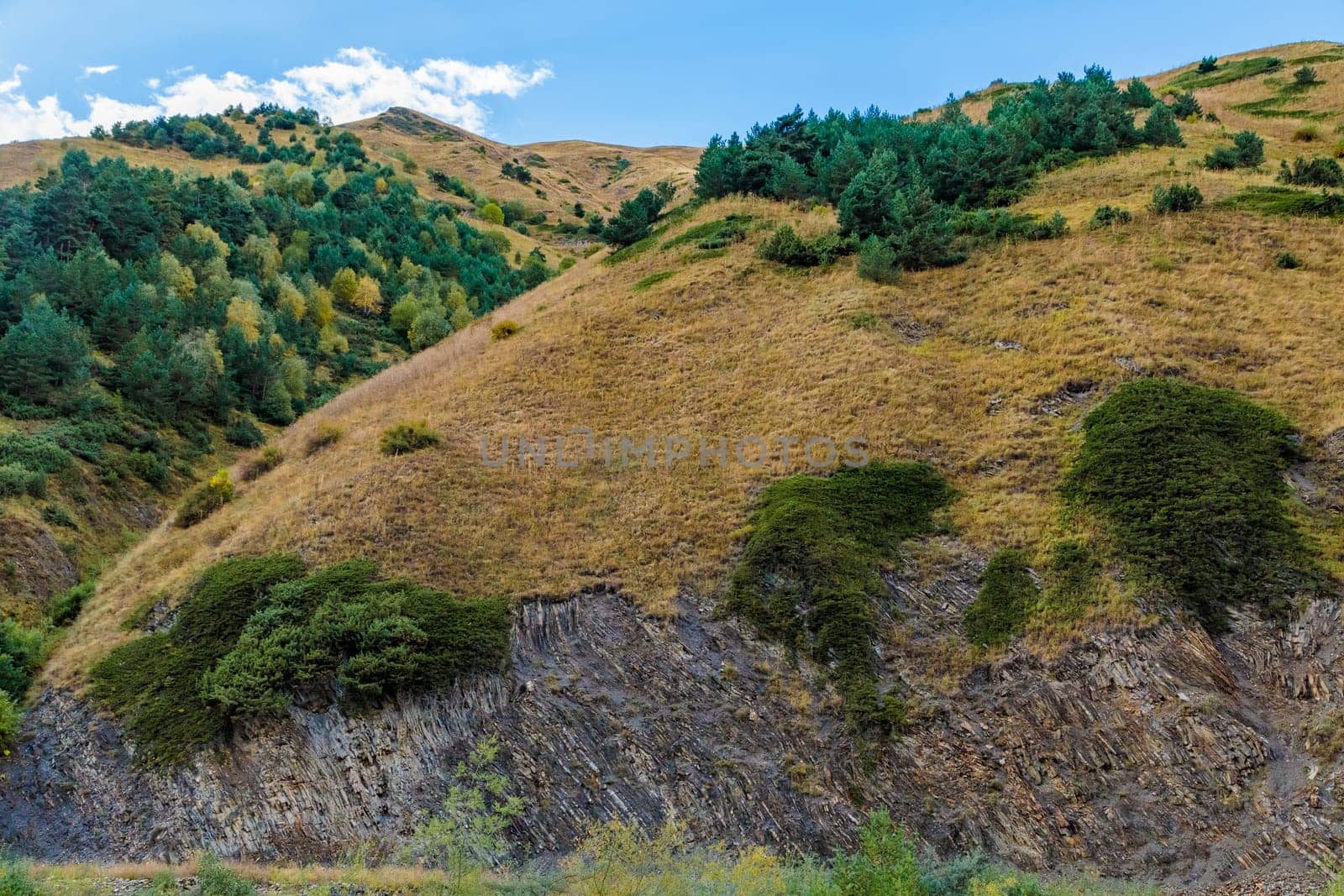 Highlands of North Ossetia. Mountains of the Caucasus. High mountains in the rays of the setting sun
