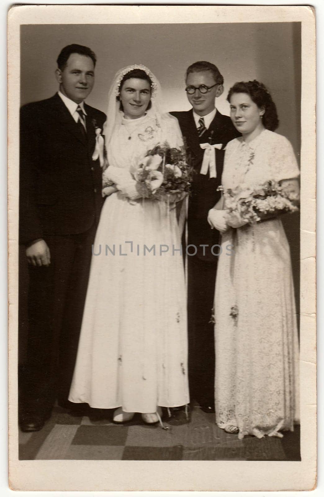 Vintage photo of two newlyweds couples. Black & white antique studio portrait. by roman_nerud