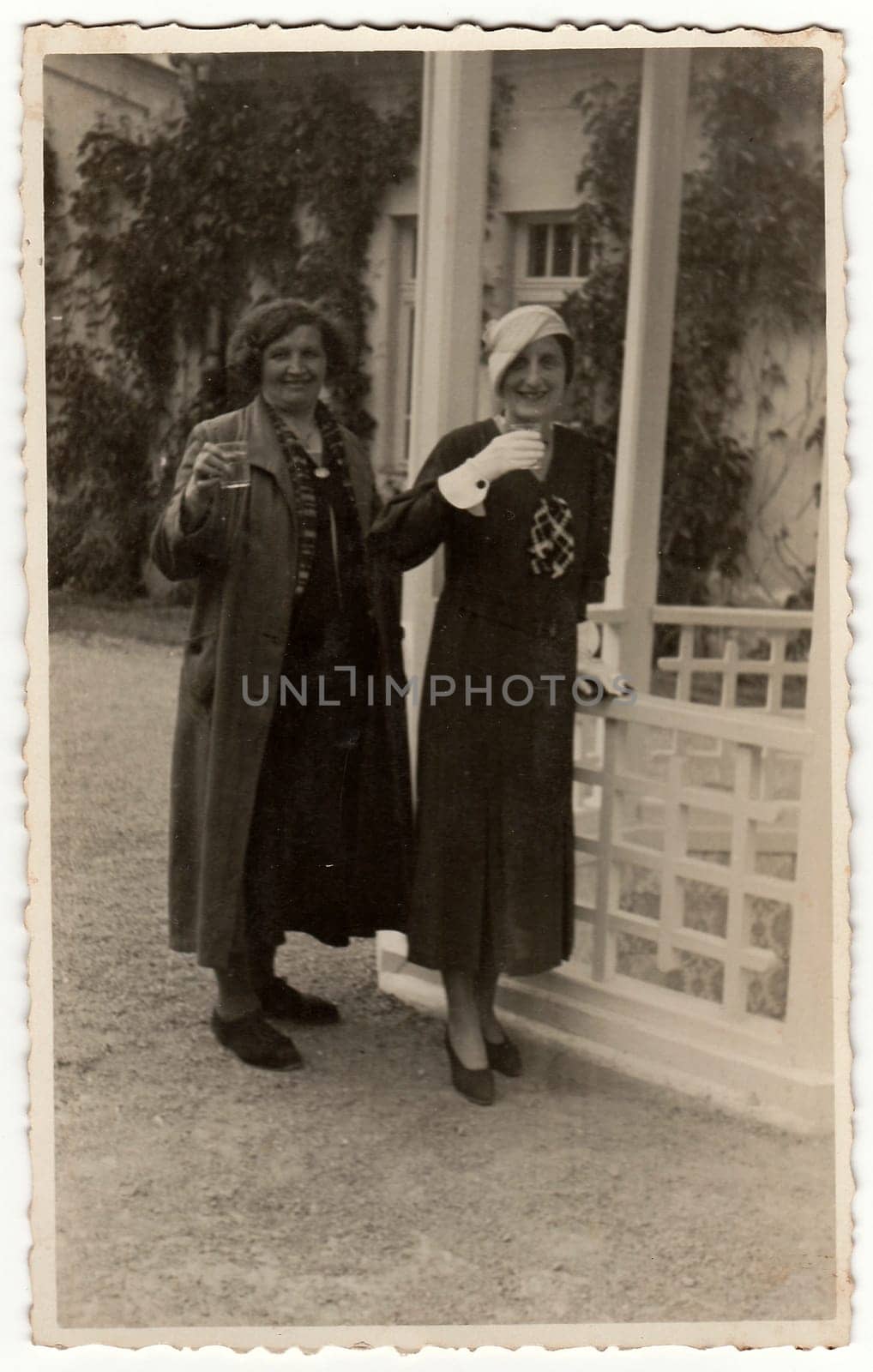 TRENCIANSKE TEPLICE, THE CZECHOSLOVAK REPUBLIC - CIRCA 1930s: Vintage photo shows elegant women at the spa resort. Black & white antique photography.