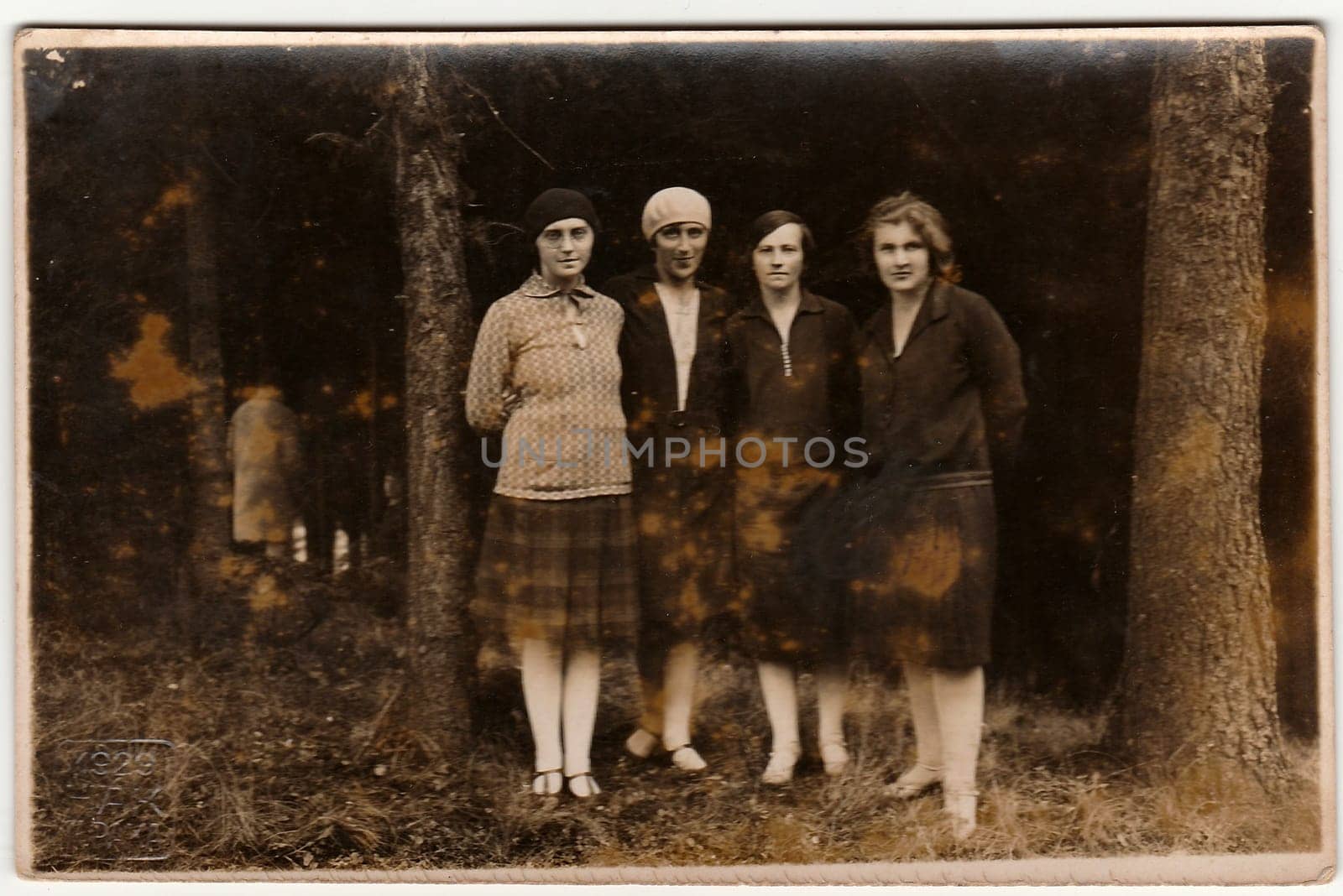 NOVA PAKA, THE CZECHOSLOVAK REPUBLIC - 1929: Vintage photo shows young women pose in nature. Black & white antique photography.