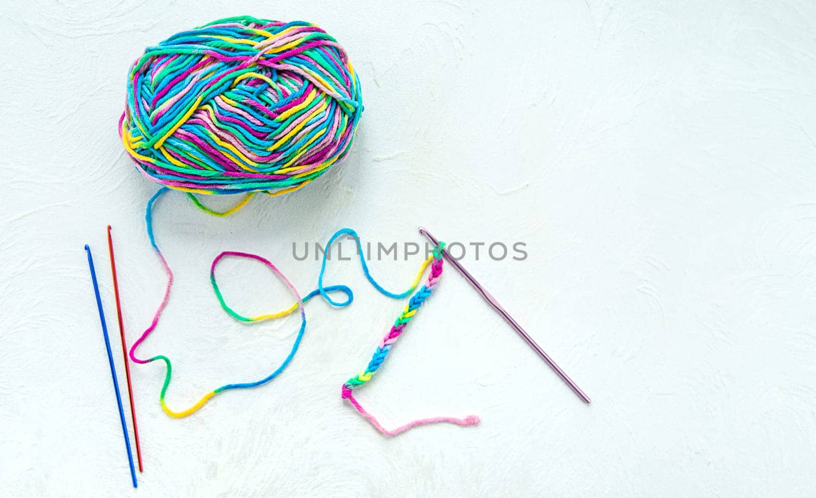 Threads and crochet hook. Selective focus. by yanadjana