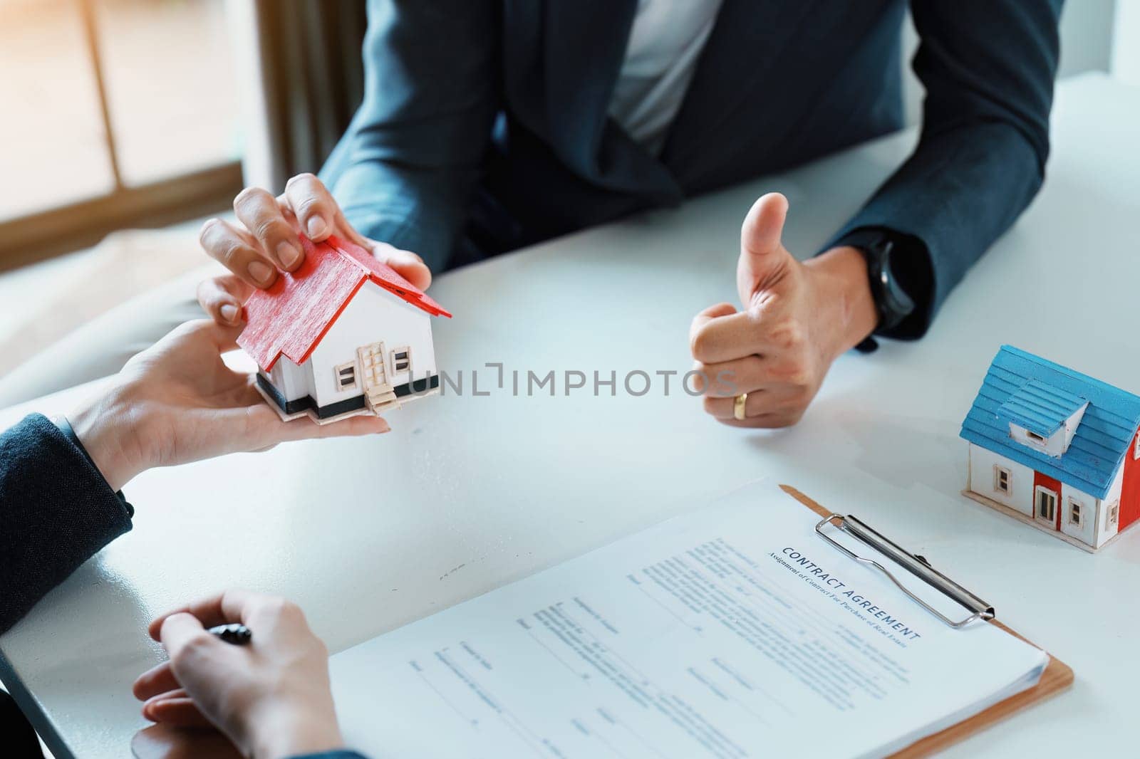 Guarantee, mortgage, agreement, contract, sign, real estate agent delivers the house to the customer after signing important contract documents.