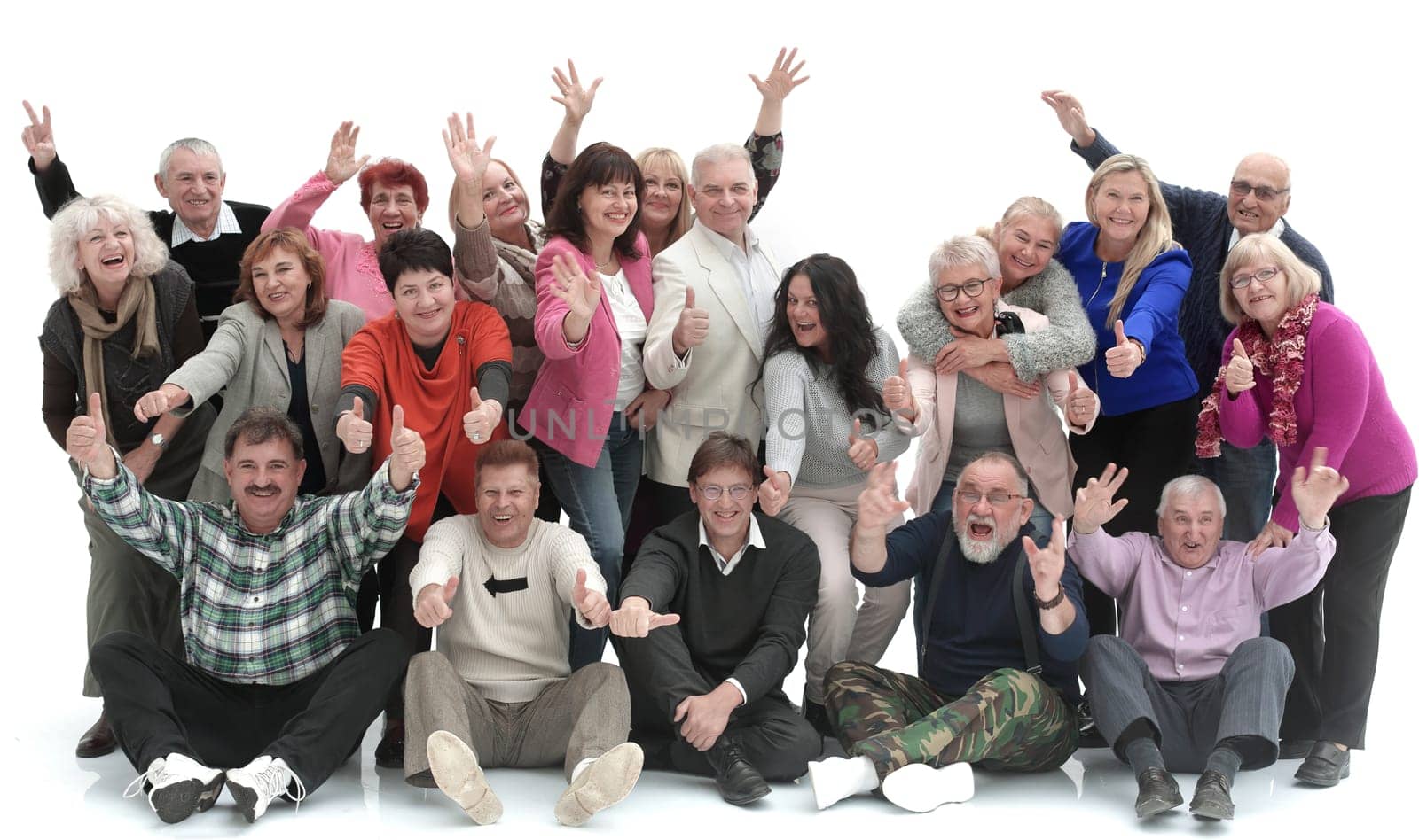 Group of happy elderly people standing and sitting isolated over a white