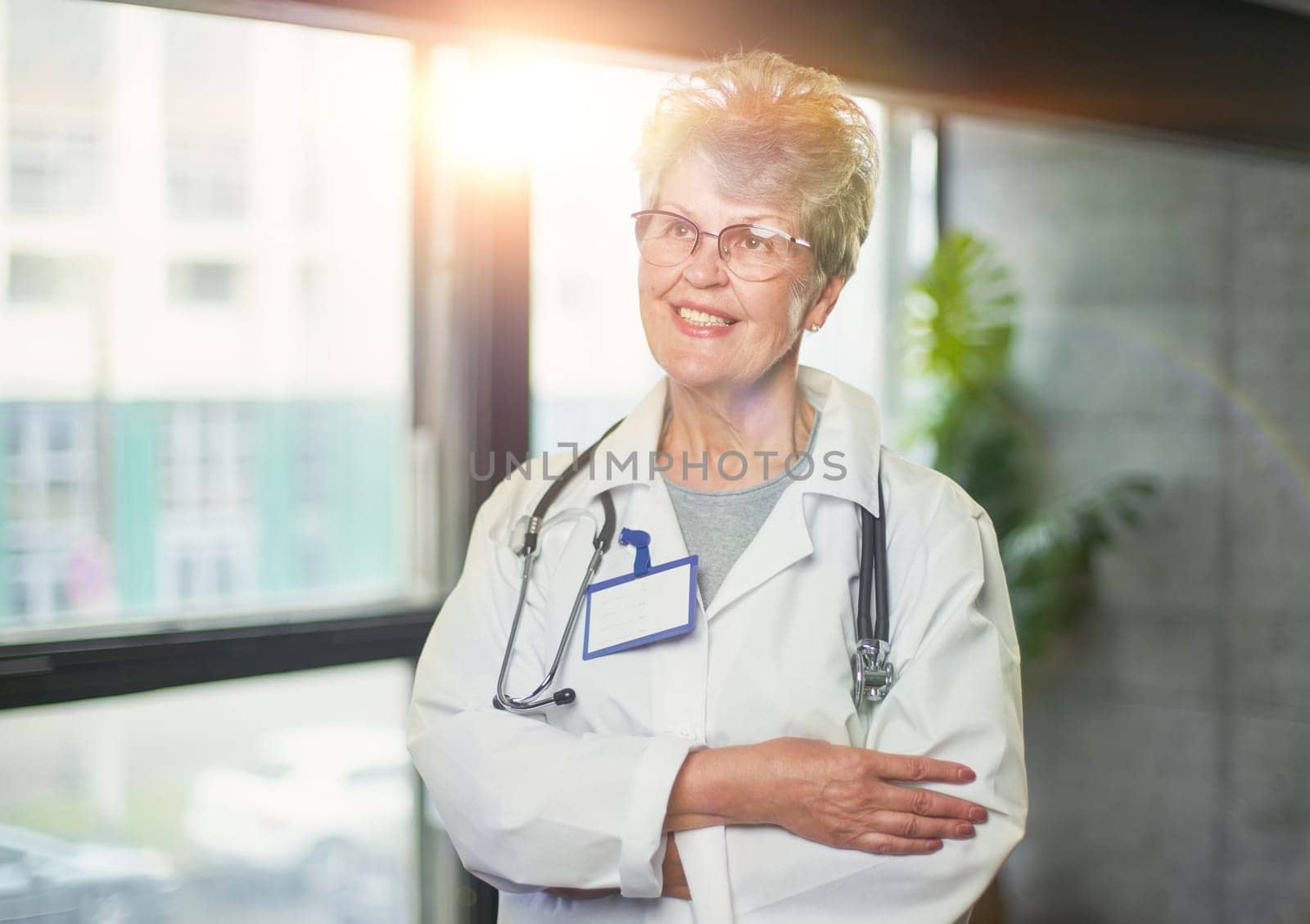 Friendly mature female doctor at hospital smiling