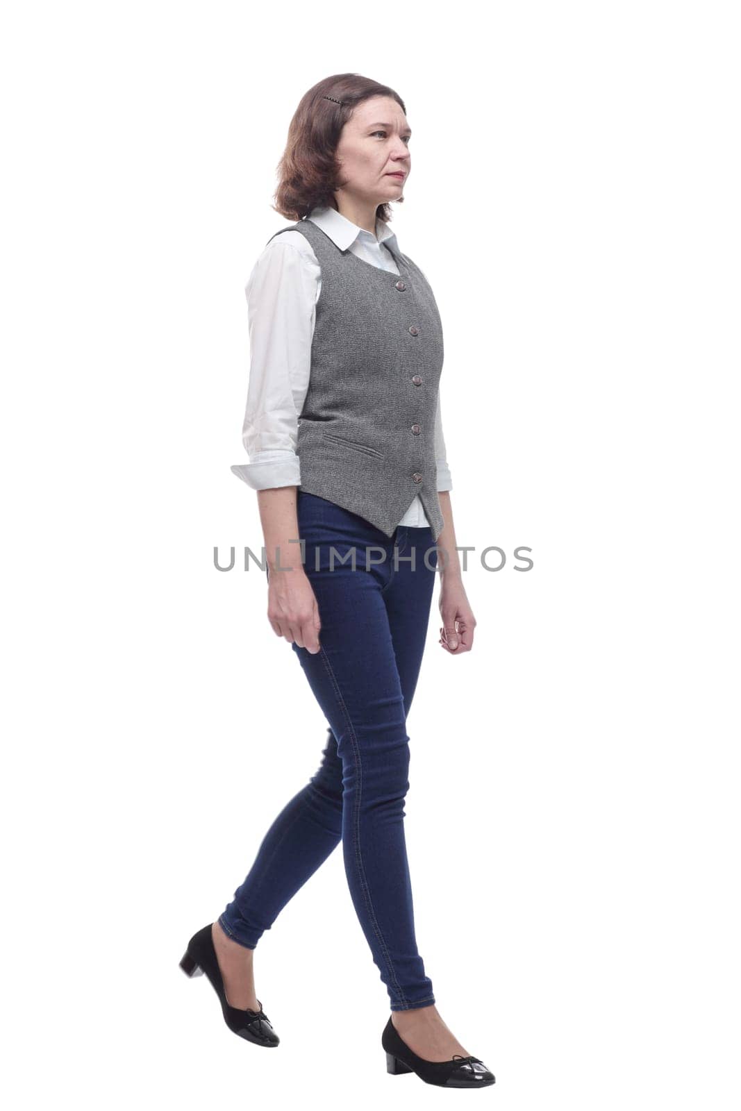 Mature woman in casual clothes walking forward. isolated on a white background.