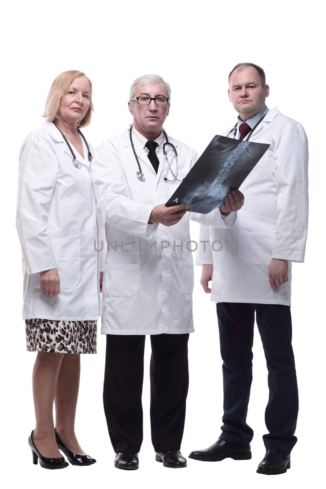 group of leading medical specialists looking at an x-ray. isolated on a white background.