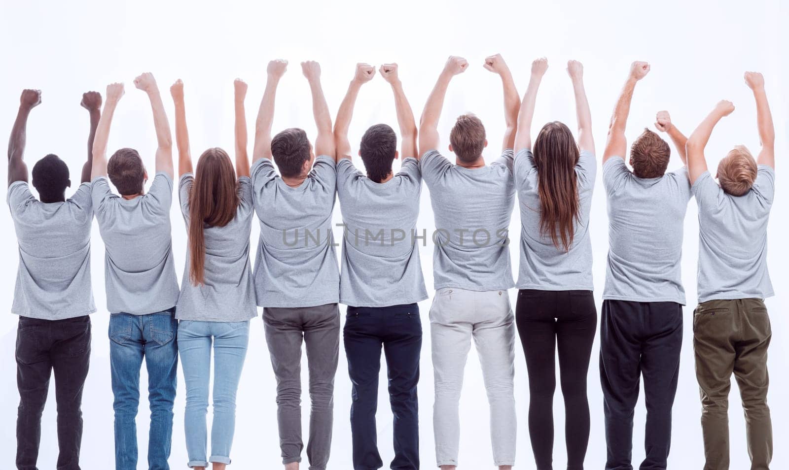 rear view. a group of young like-minded people holding their hands up. isolated on white