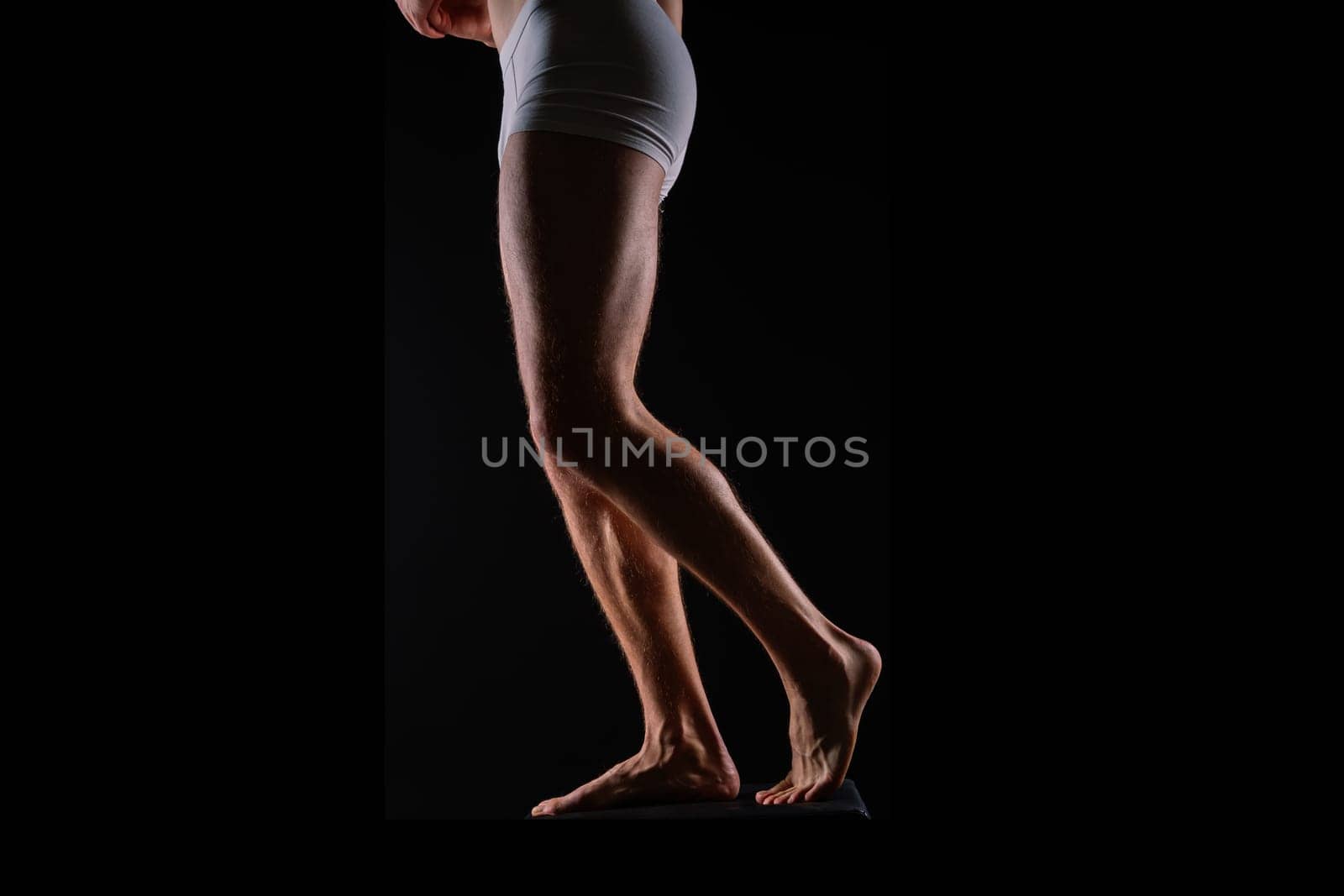 Close-Up of Bodybuilders Legs Ready For Competitive Sport white panties by Zelenin