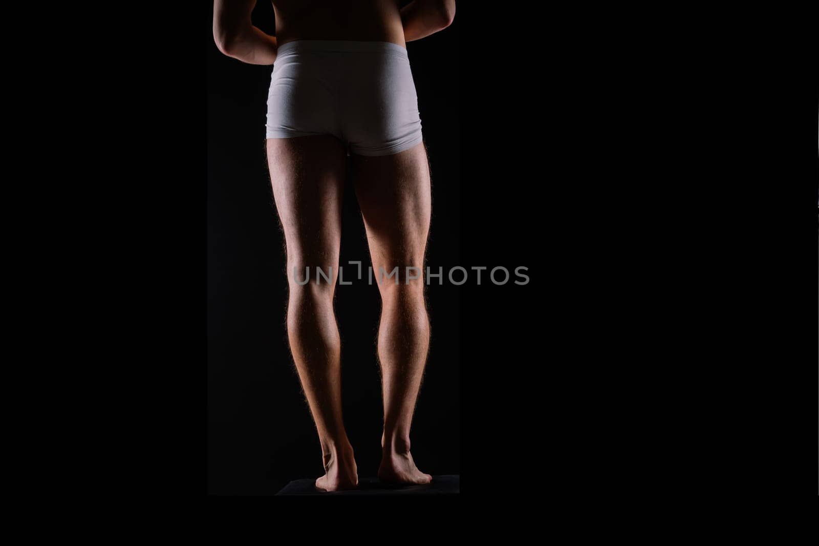 Close-Up of Bodybuilders Legs Ready For Competitive Sport white panties by Zelenin