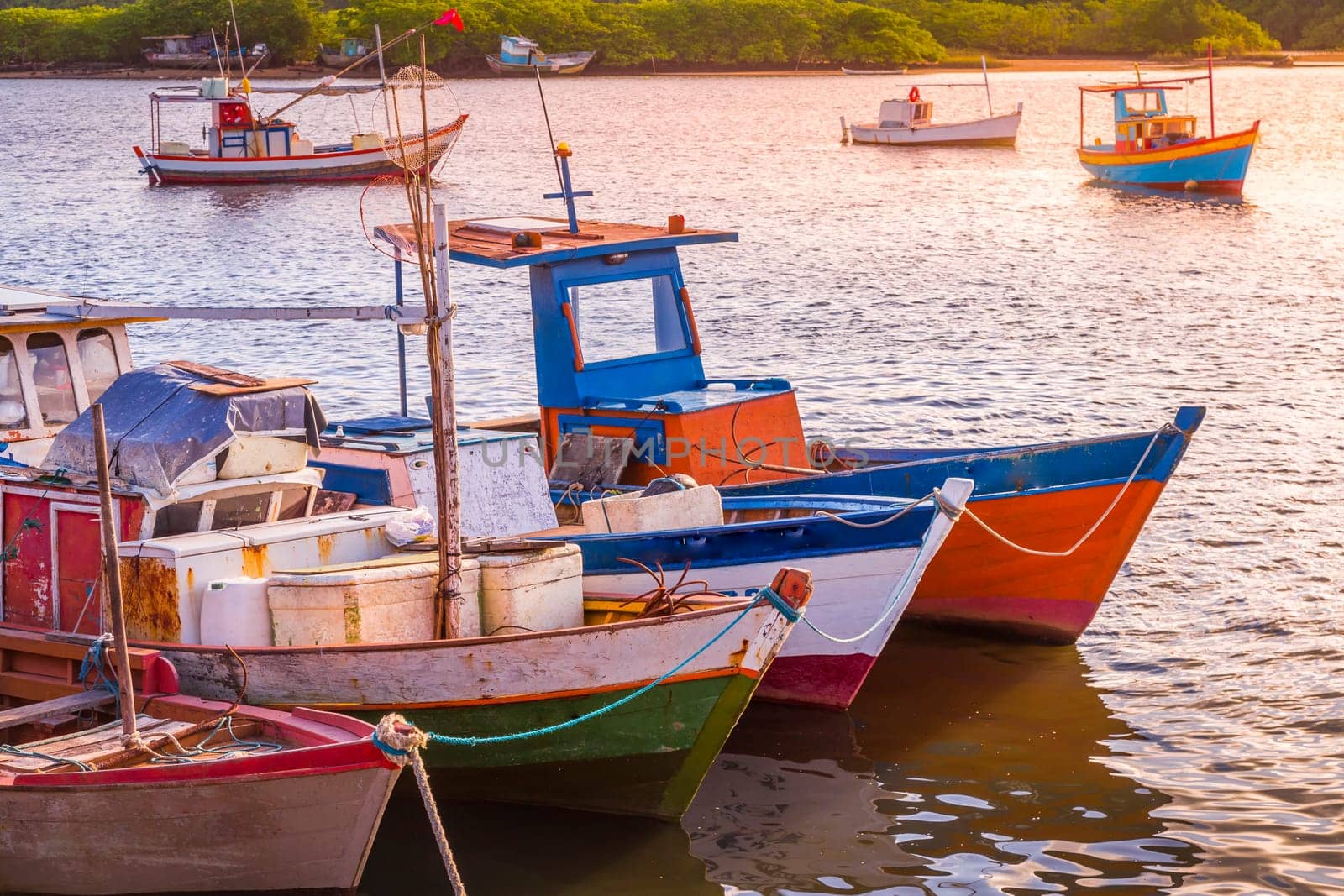 Idyllic Porto Seguro Beach at sunset with fishermen rustic wooden boats, BAHIA, Brazil