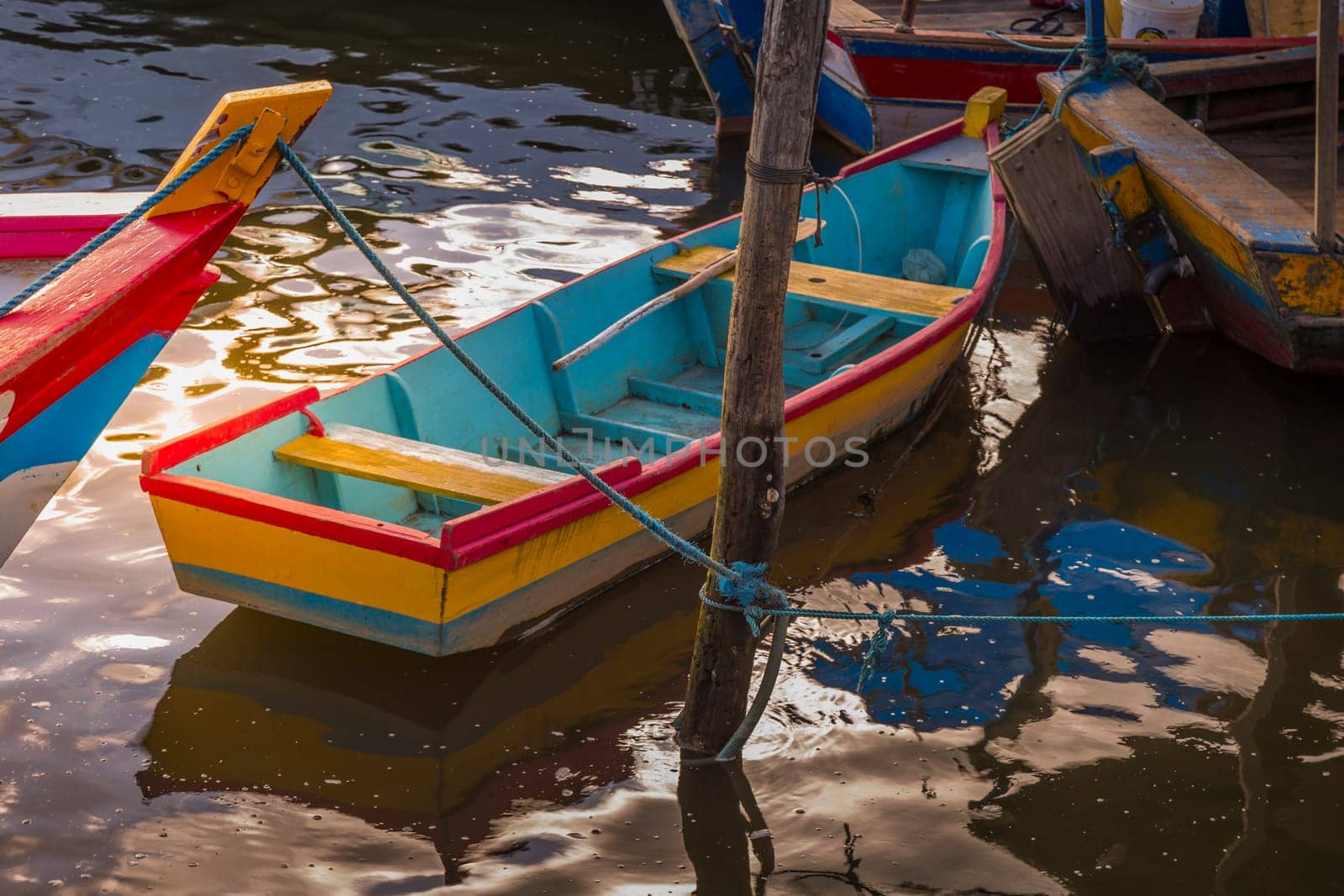 Idyllic Porto Seguro Beach at sunset with fishermen rustic wooden boats, BAHIA, Brazil