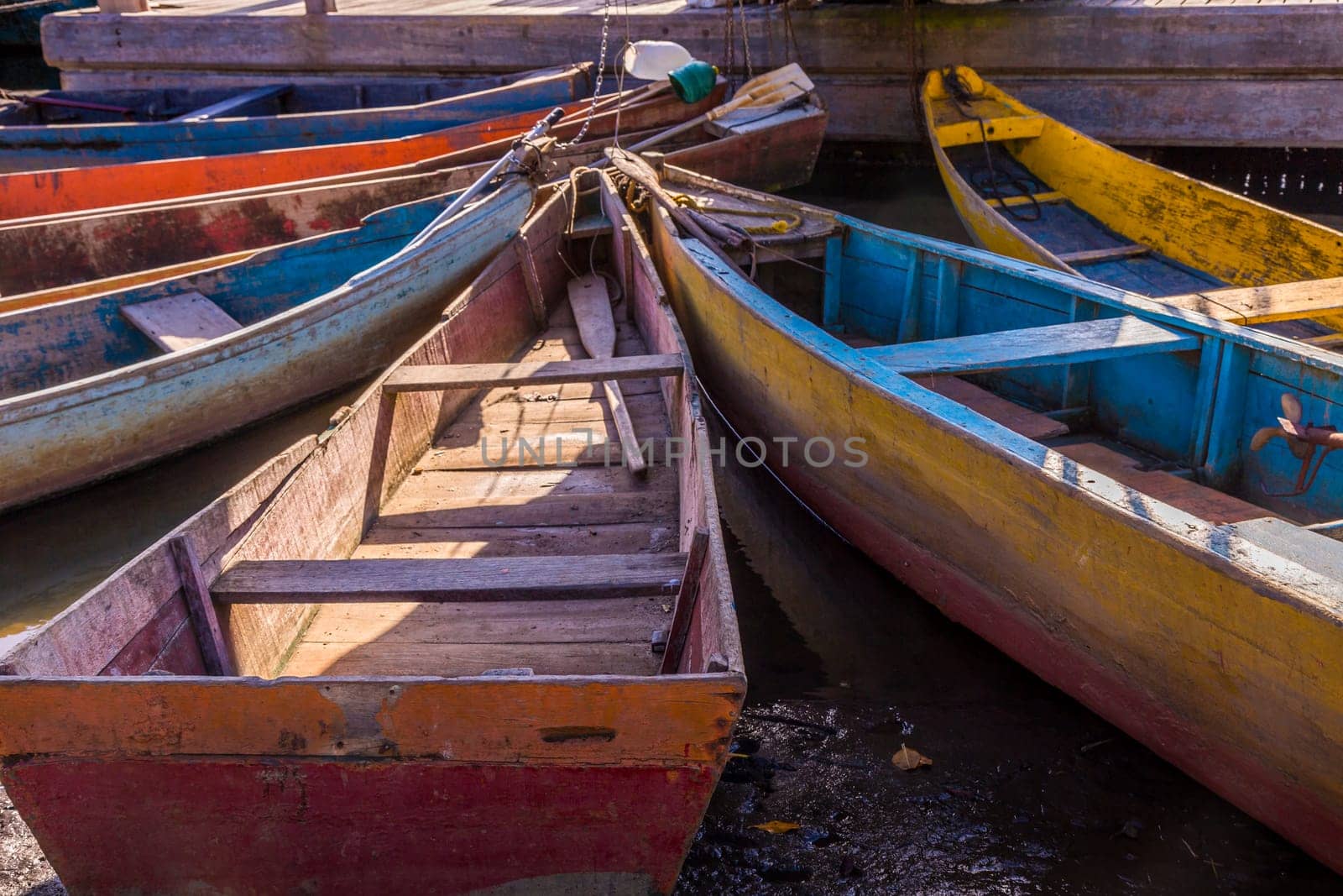 Idyllic Porto Seguro Beach at sunset with fishermen rustic wooden boats, BAHIA, Brazil
