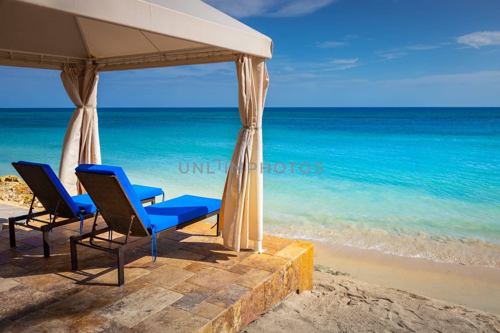 Tropical caribbean beach with turquoise waters in idyllic Montego Bay, Jamaica
