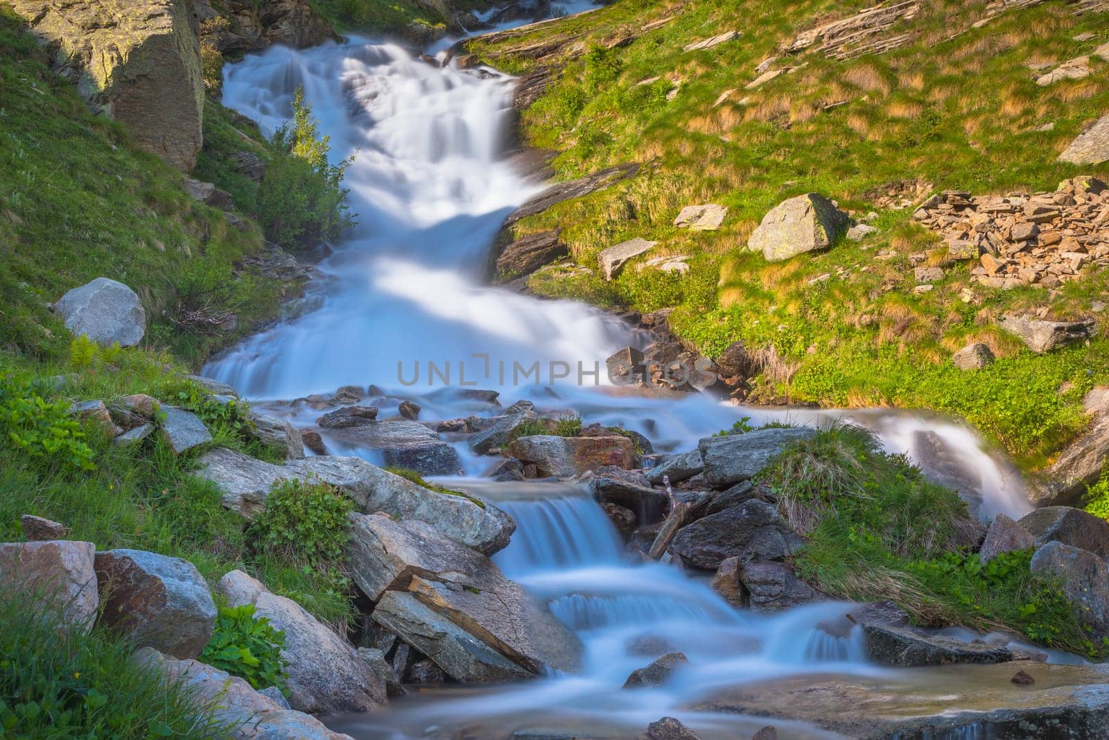 Waterfall in Gran Paradiso national park, Aosta Valley in the italian Alps, northern Italy
