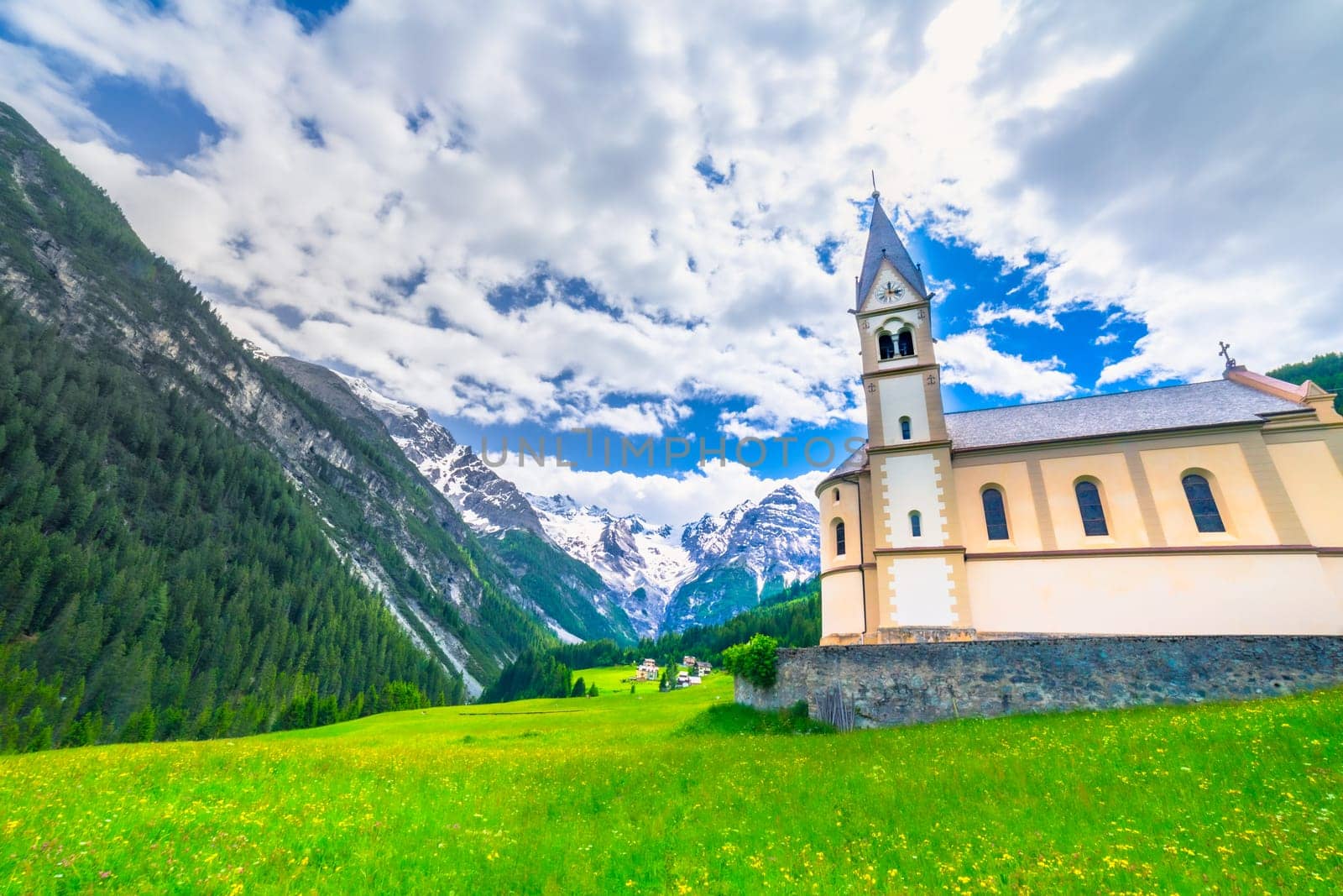 Idyllic village in Stelvio pass valley and Ortler massif, italian Dolomites at springtime, Italy