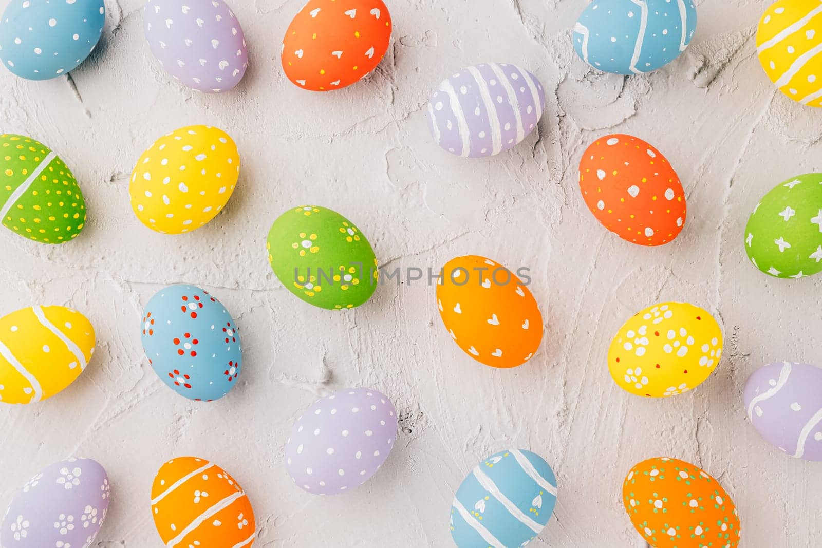 Easter Day Concept. Top view holiday banner background web design white colorful easter eggs painted on white cement background with empty copy space, celebration greeting card, overhead, template