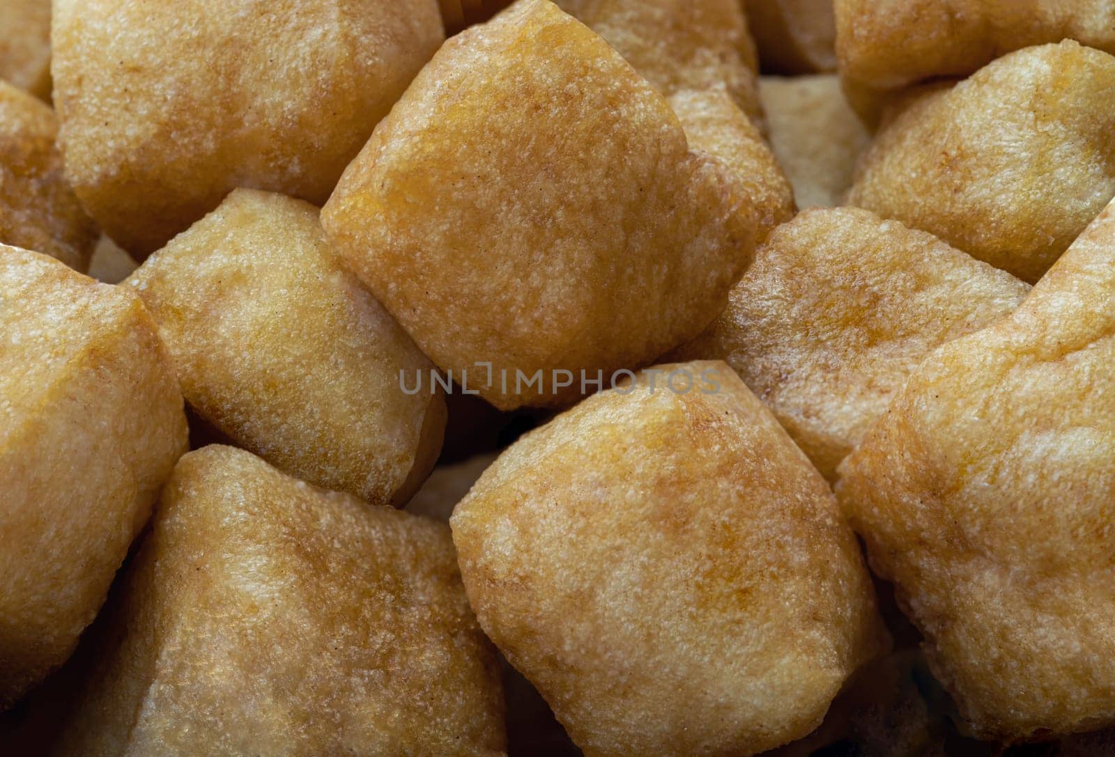 Close up of Brown fried tofu puffs or Deep Fried Tofu. Healthy asian food, Space for text.