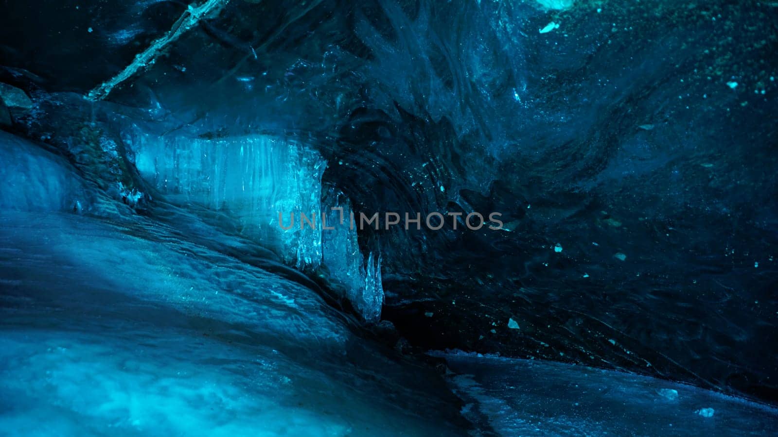Turquoise pure color of ice inside the ice cave. by Passcal