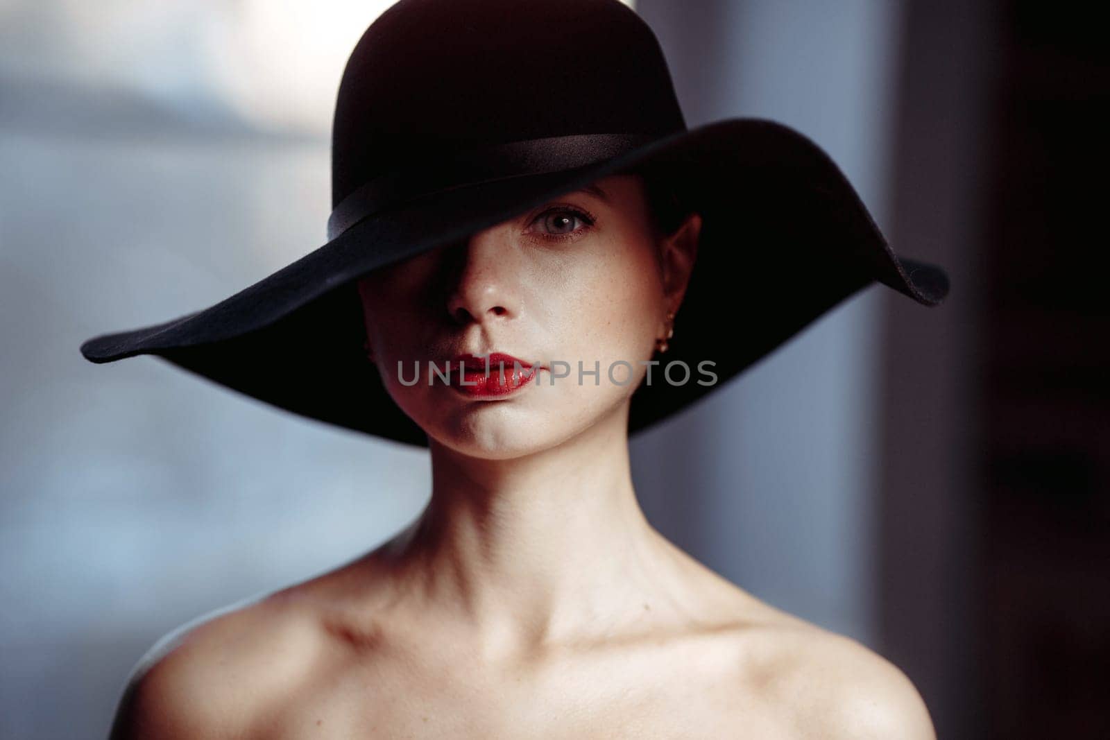 Woman portrait black hat one seeing eye and bare shoulders by Demkat