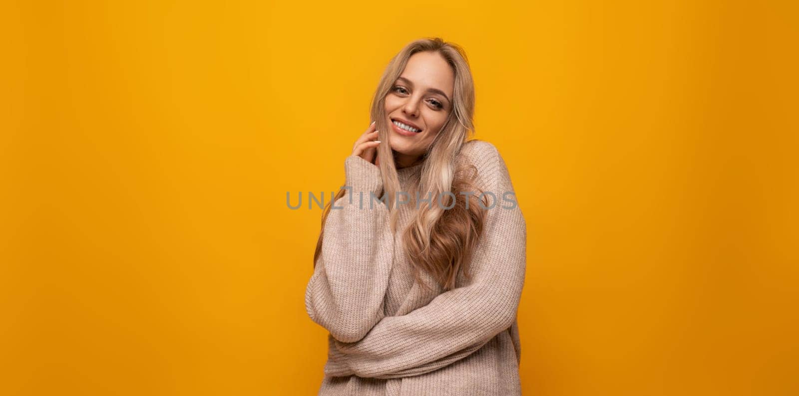 young woman posing over isolated yellow background.