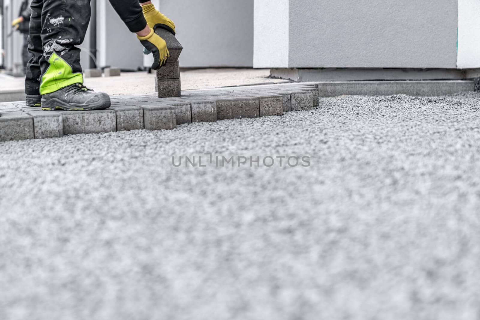 construction of a sidewalk from concrete blocks.