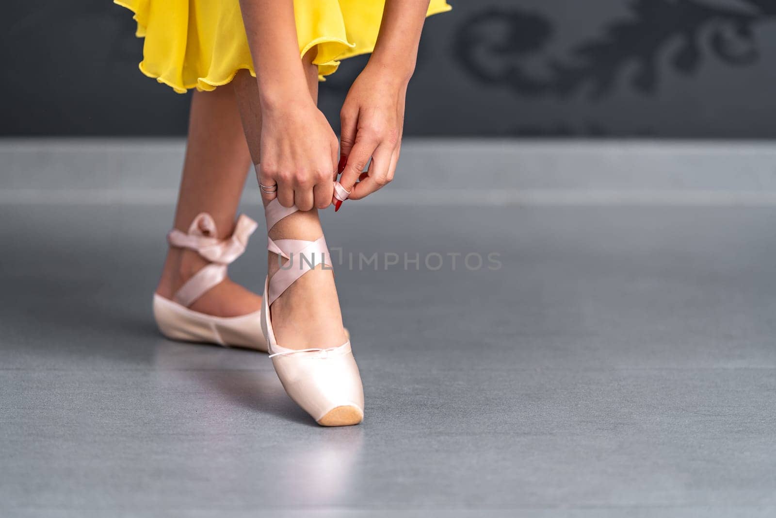 ballet shoes on the feet of a ballerina. High quality photo