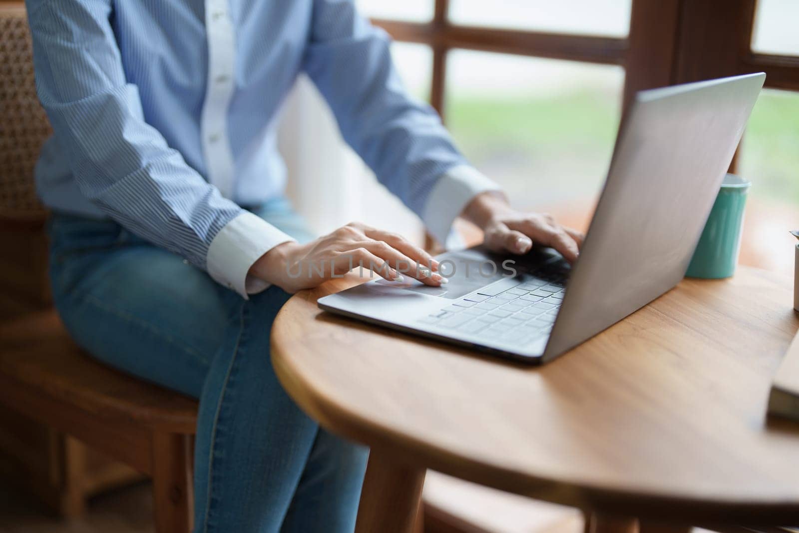 Portrait of a beautiful Asian teenage girl using a computer.