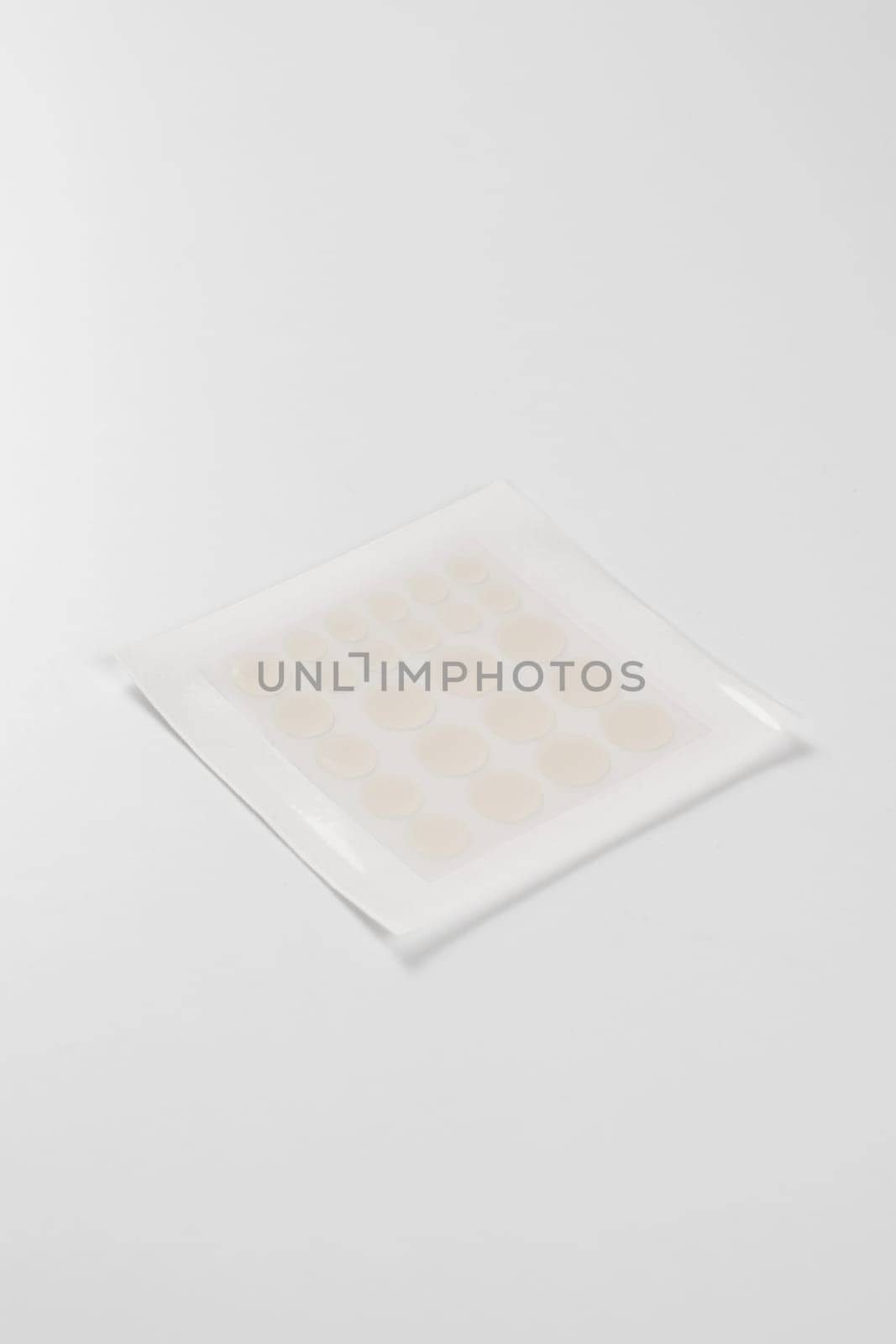 Set of round acne patches on white background. Close-up acne patch facial rejuvenation. Facial cleansing cosmetology