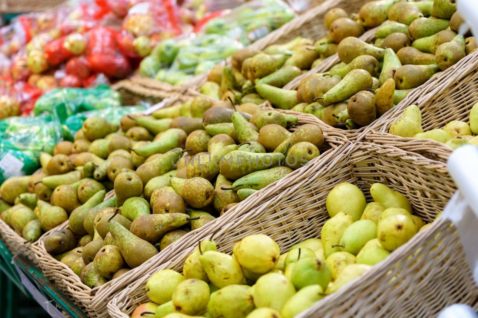 Ripe pears on the counter in the supermarket, farmer market. Fresh food. Selective focus