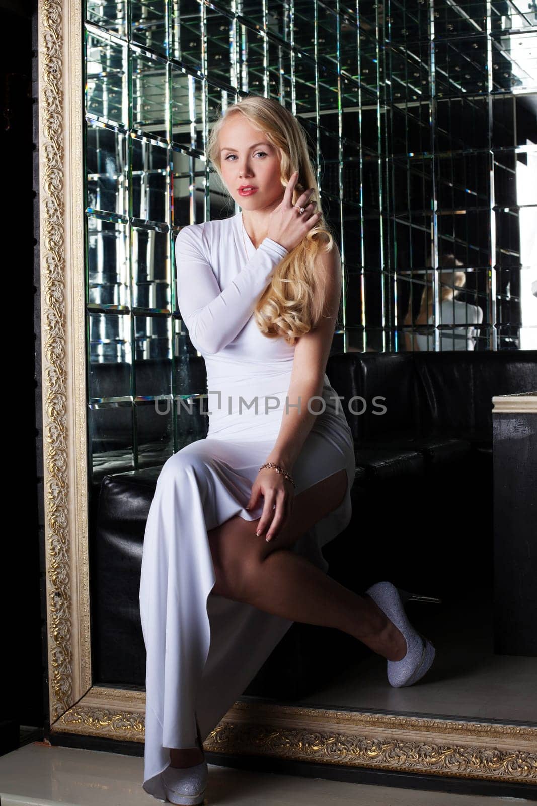 Image of luxury blonde posing in long dress, close-up