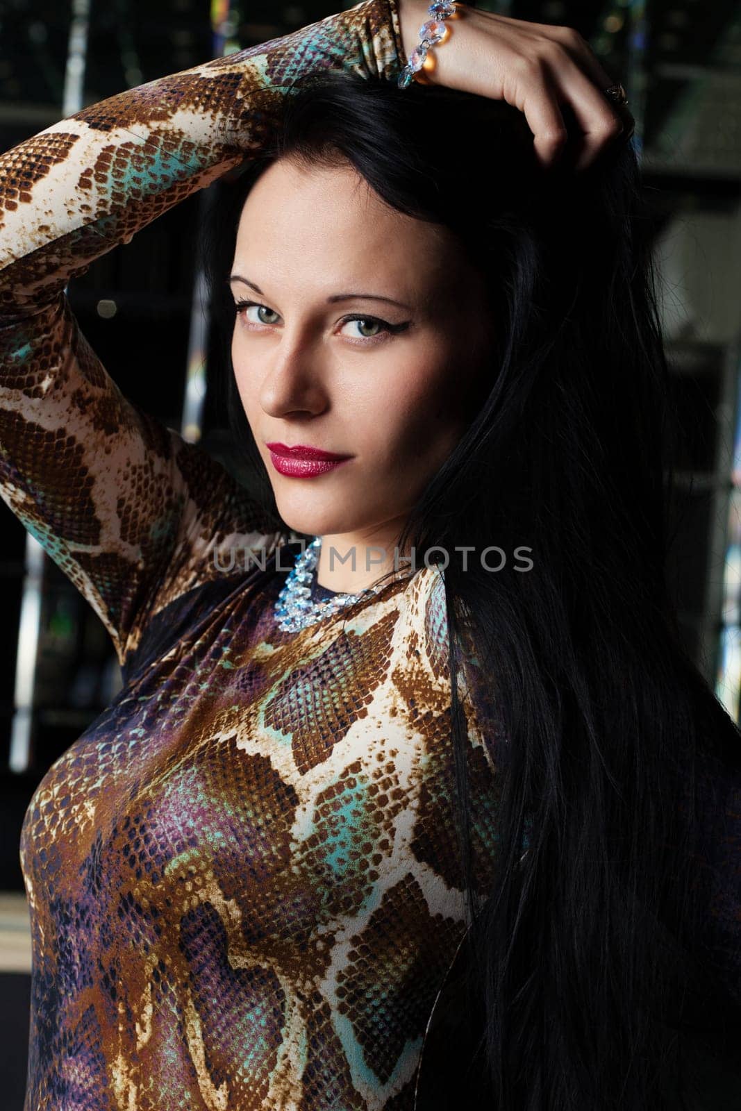 Portrait of young brunette woman in nightclub