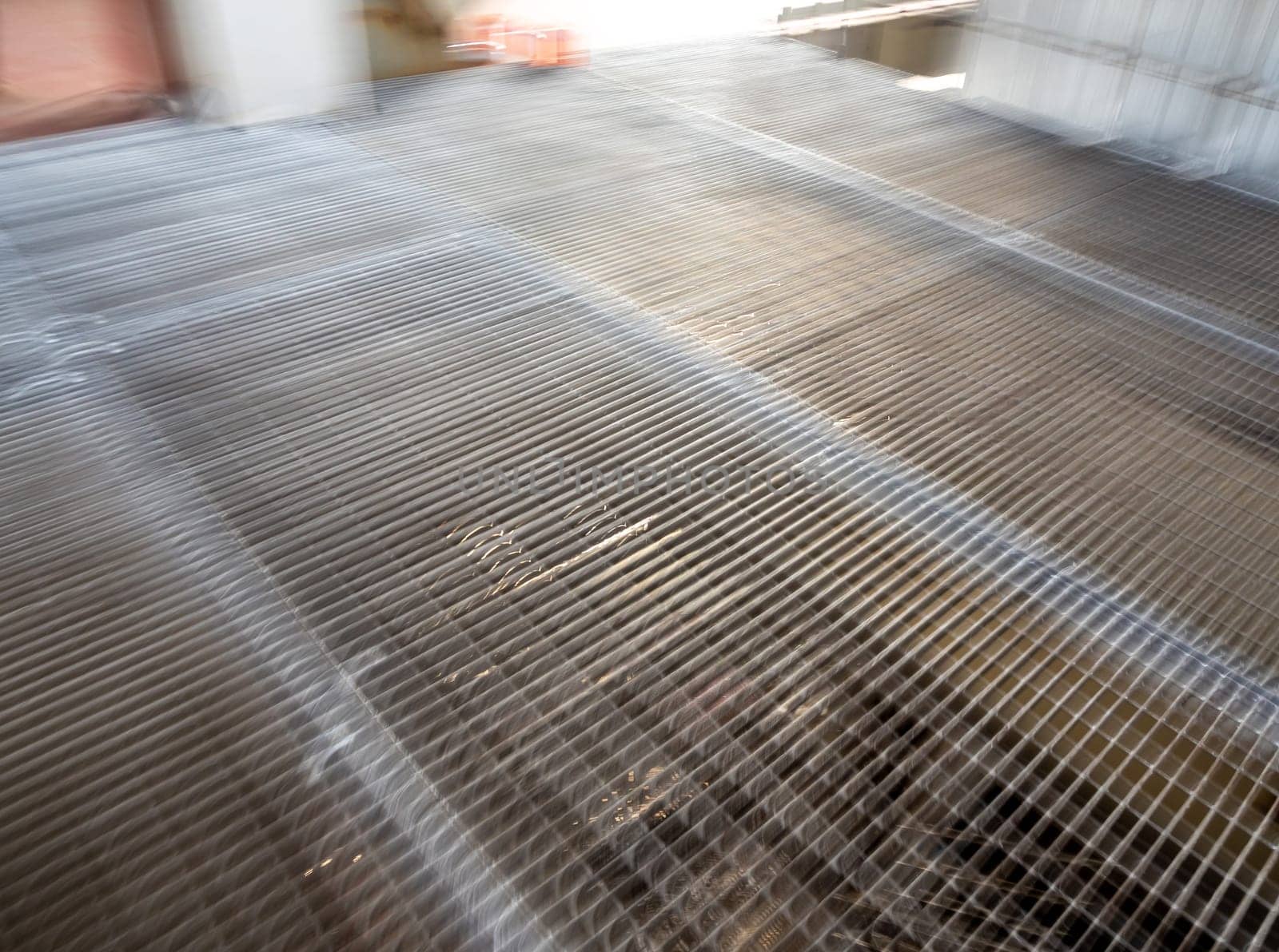 Movement blured of The Metal grating walkway on the mill by Satakorn