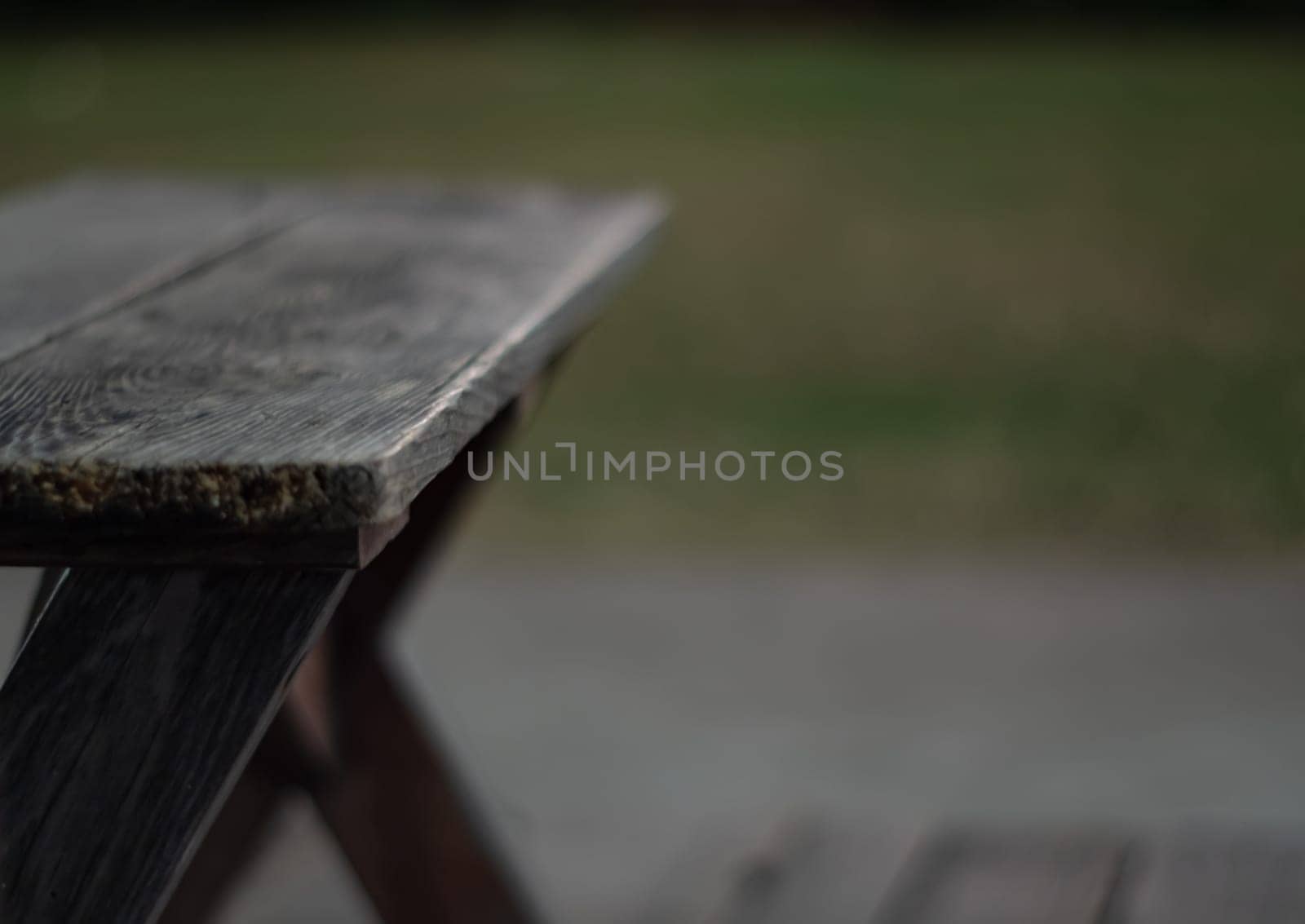 The shabby patio wooden furniture in the garden