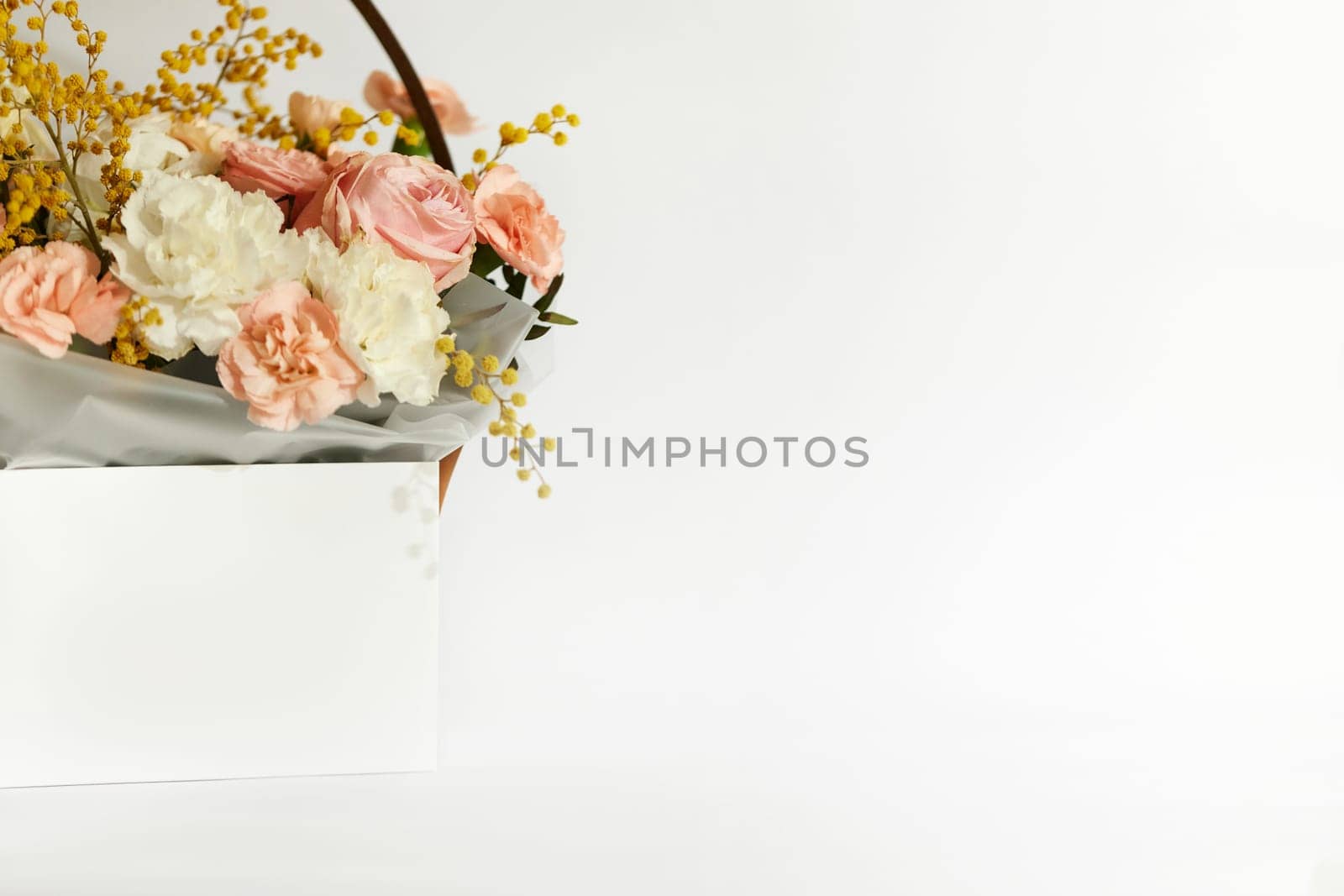 box with beautiful bouquet white and pink flowers on white background. Spring flowers. copy space