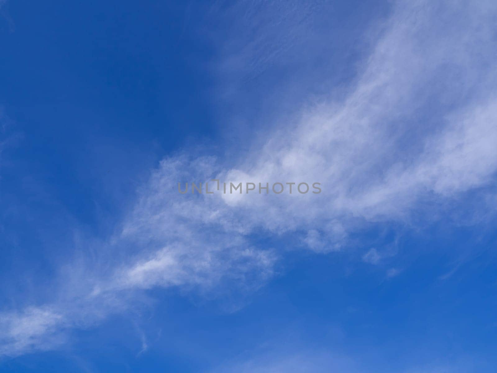 Fluffy clouds floating scattered across the sky