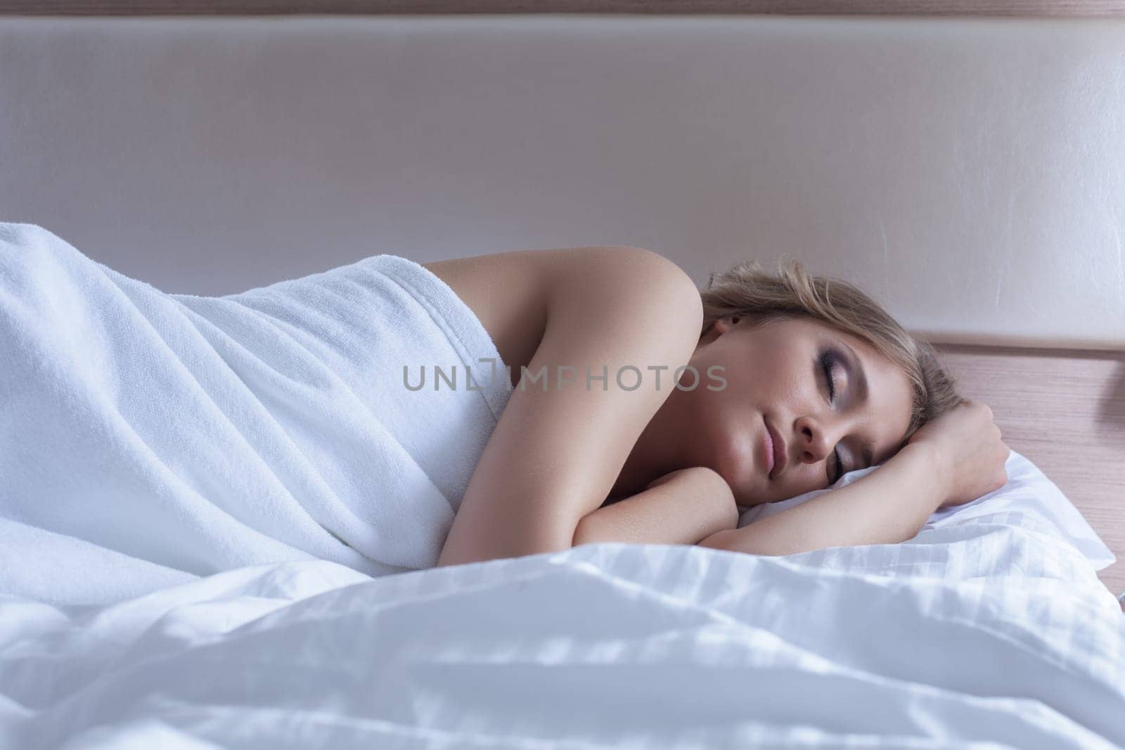 Portrait of pretty woman sleeping in bedroom