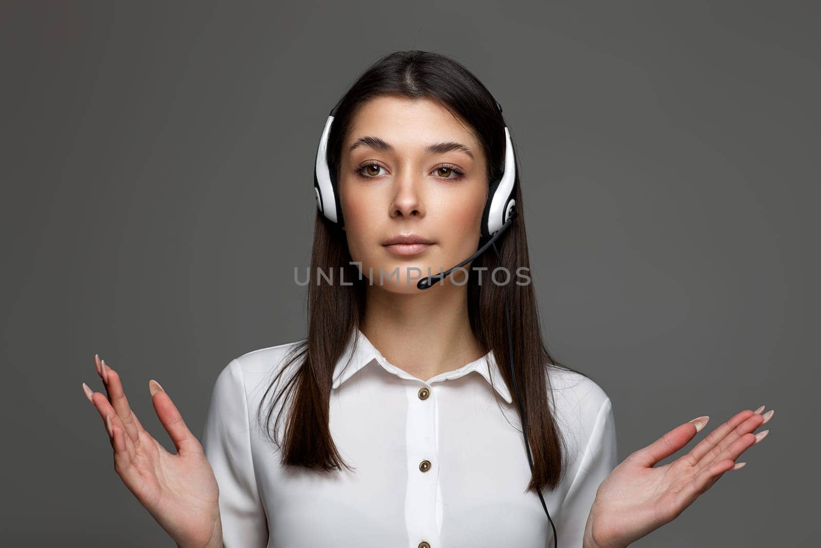 friendly woman with headset is consulting clients online. Call center, business people concept