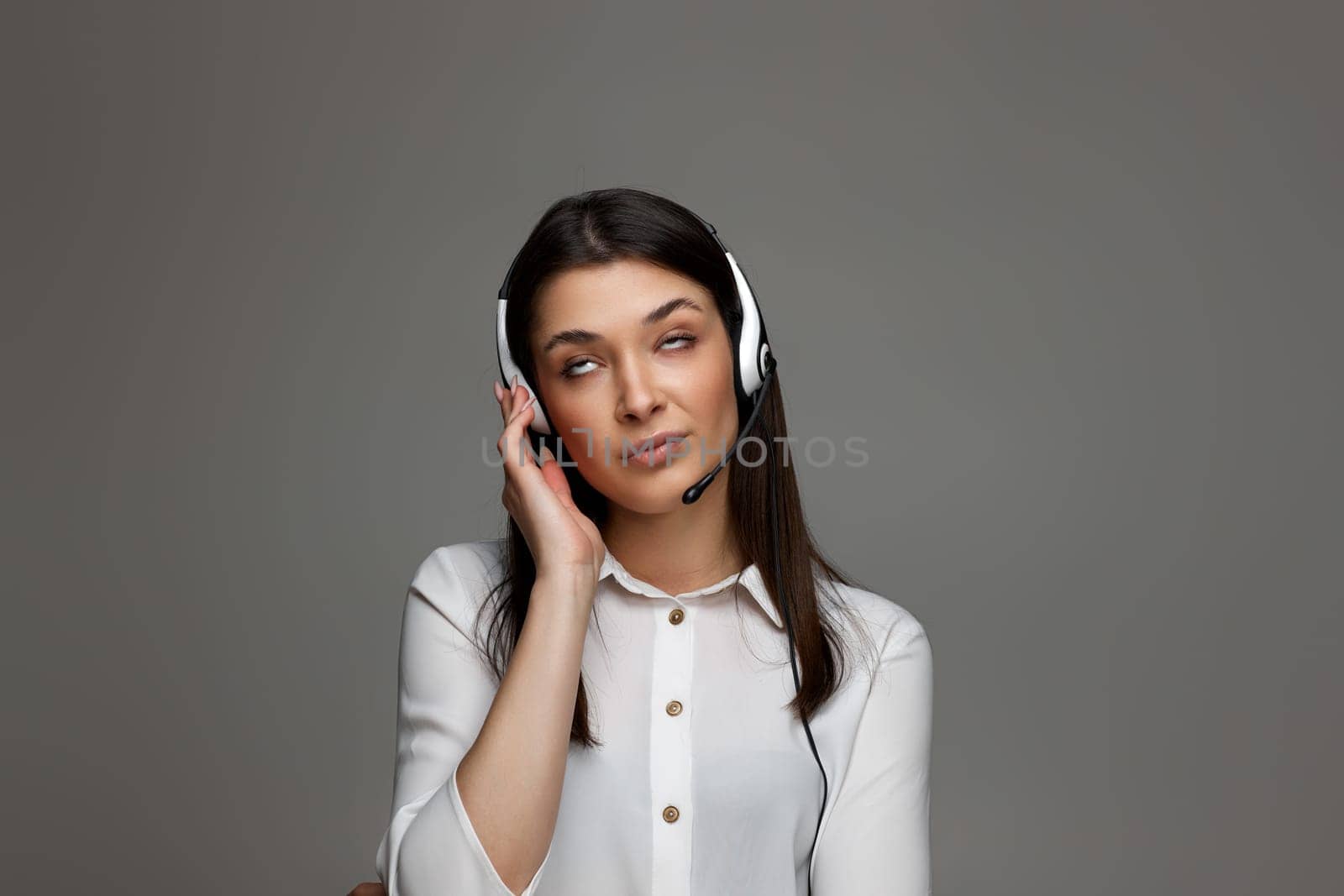 tired upset frustrated female call center agent is consulting clients online. Call center, business people concept