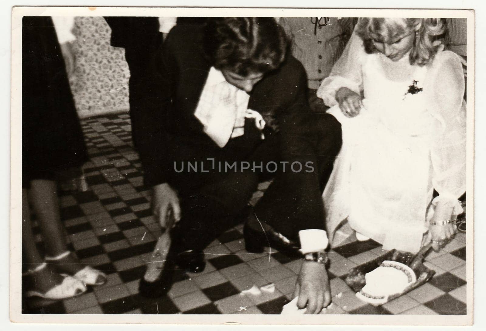 THE CZECHOSLOVAK SOCIALIST REPUBLIC - CIRCA 1970s: Retro photo shows people on wedding celebration. Black and white vintage photography.