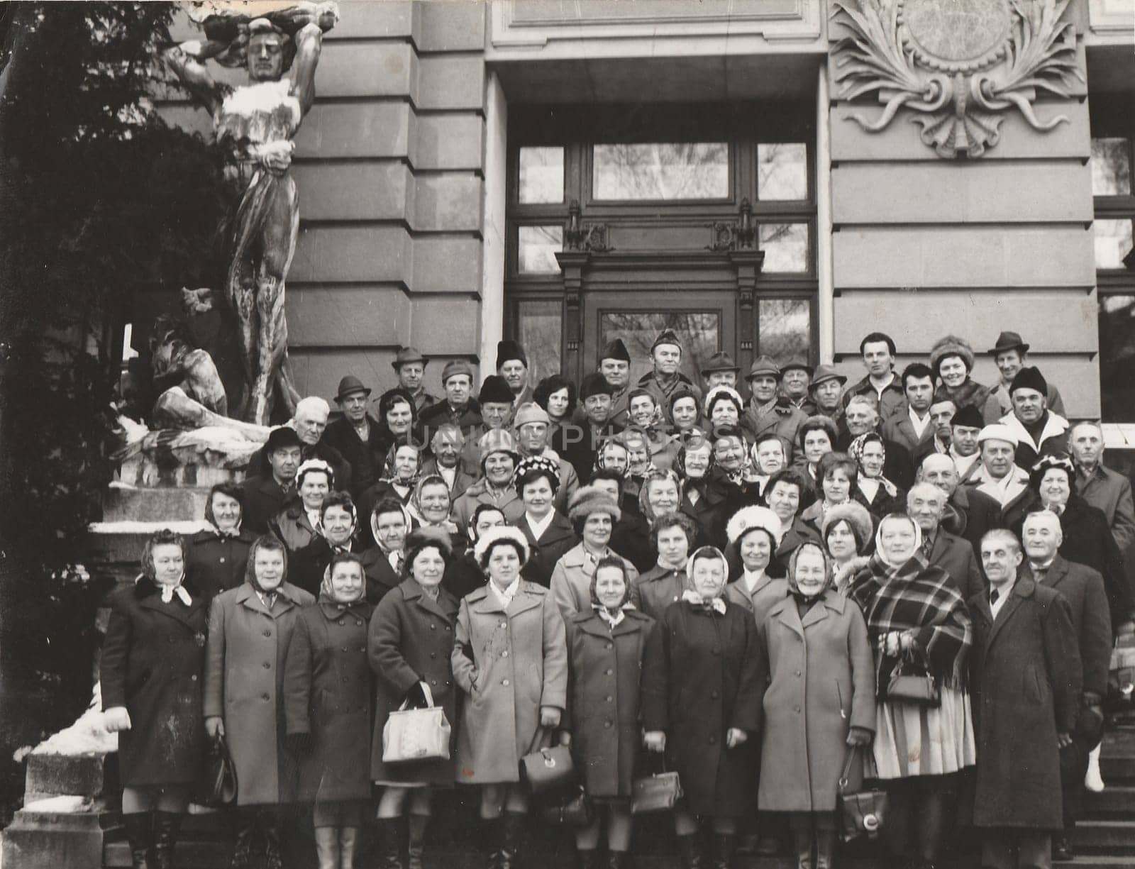 Retro photo shows a big group of people pose at the spa resort. Black and white vintage photography. by roman_nerud