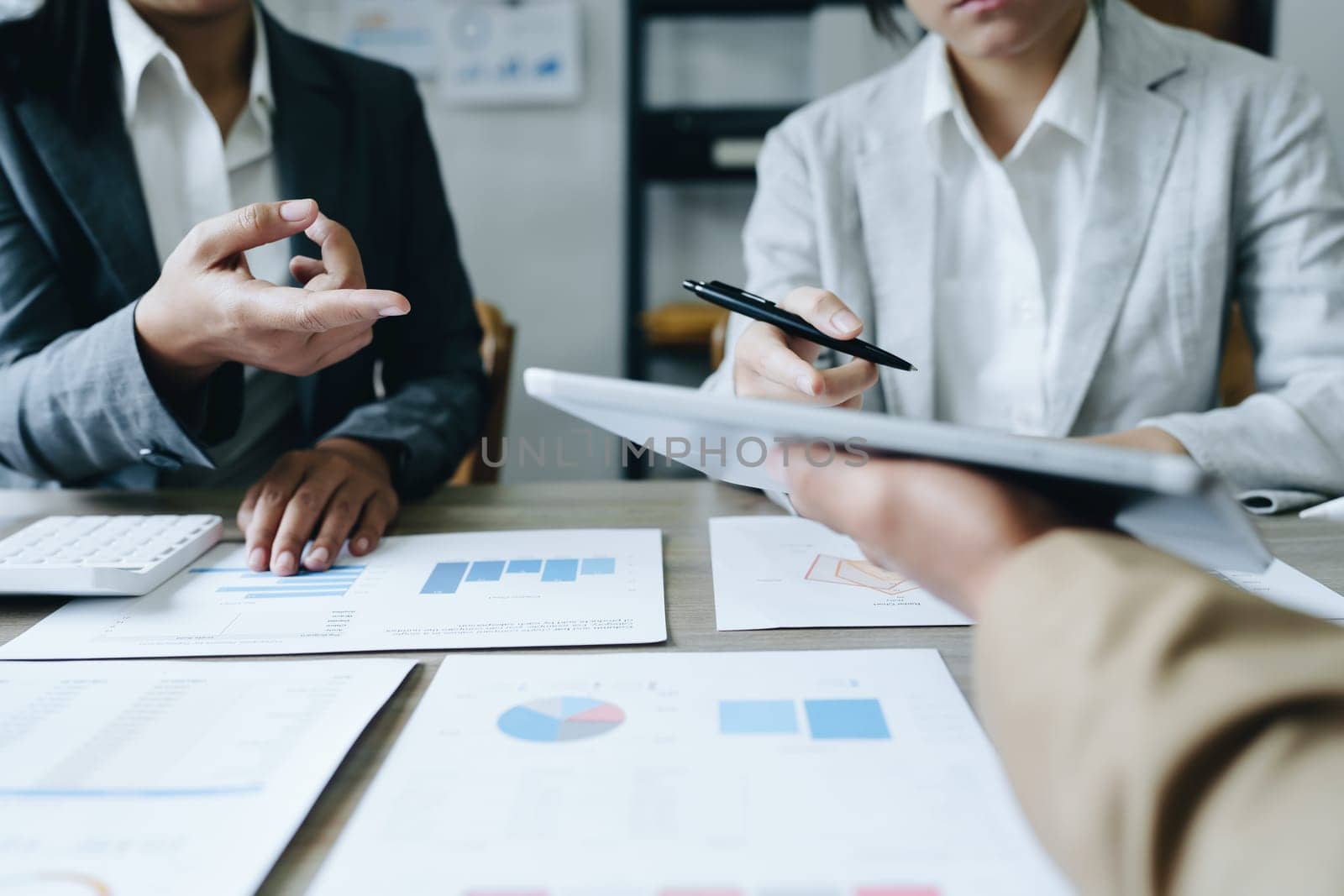 Asian entrepreneurs and business people meeting in a conference room in business planning, financial budget and investment risk assessment to analyze customer groups to increase company growth.