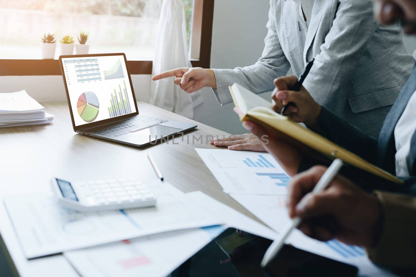 Asian entrepreneurs and business people meeting in a conference room in business planning, financial budget and investment risk assessment to analyze customer groups to increase company growth.