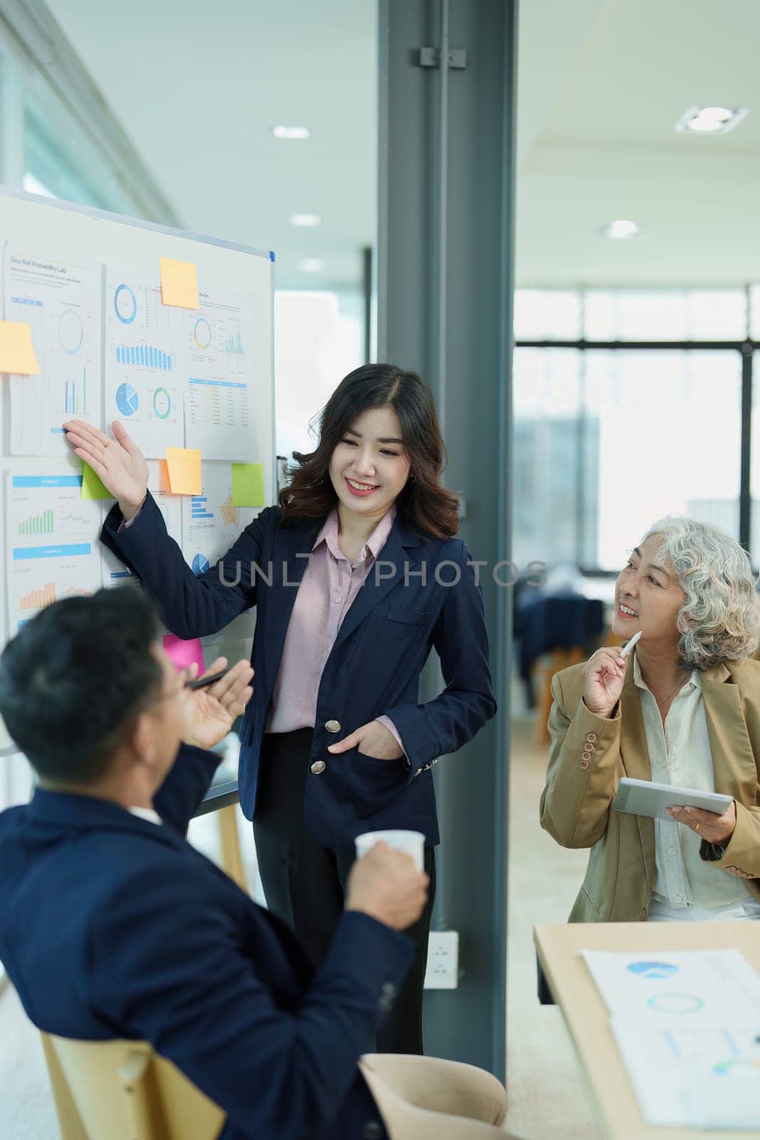 Asian entrepreneurs and business people meeting in a conference room in business planning, financial budget and investment risk assessment to analyze customer groups to increase company growth.