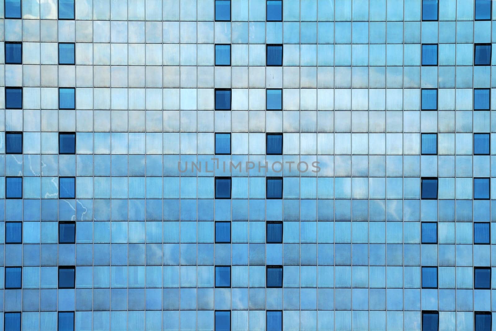 modern skyscraper glass facade for blue urban background by Annado