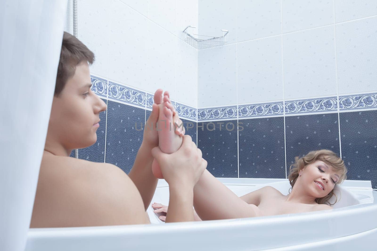 Portrait of sexy couple in bathroom