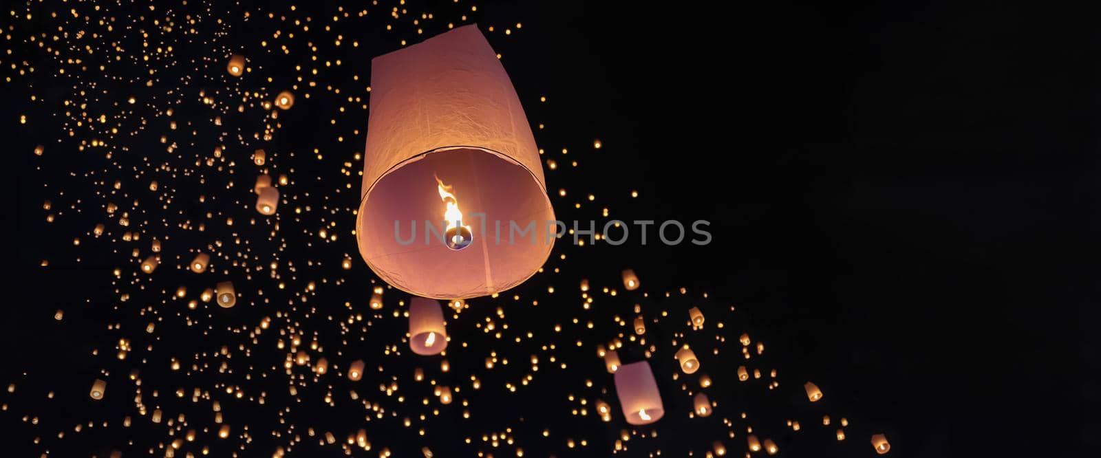 Tourist floating sky lanterns in Loy Krathong festival , Chiang Mai ,Thailand.